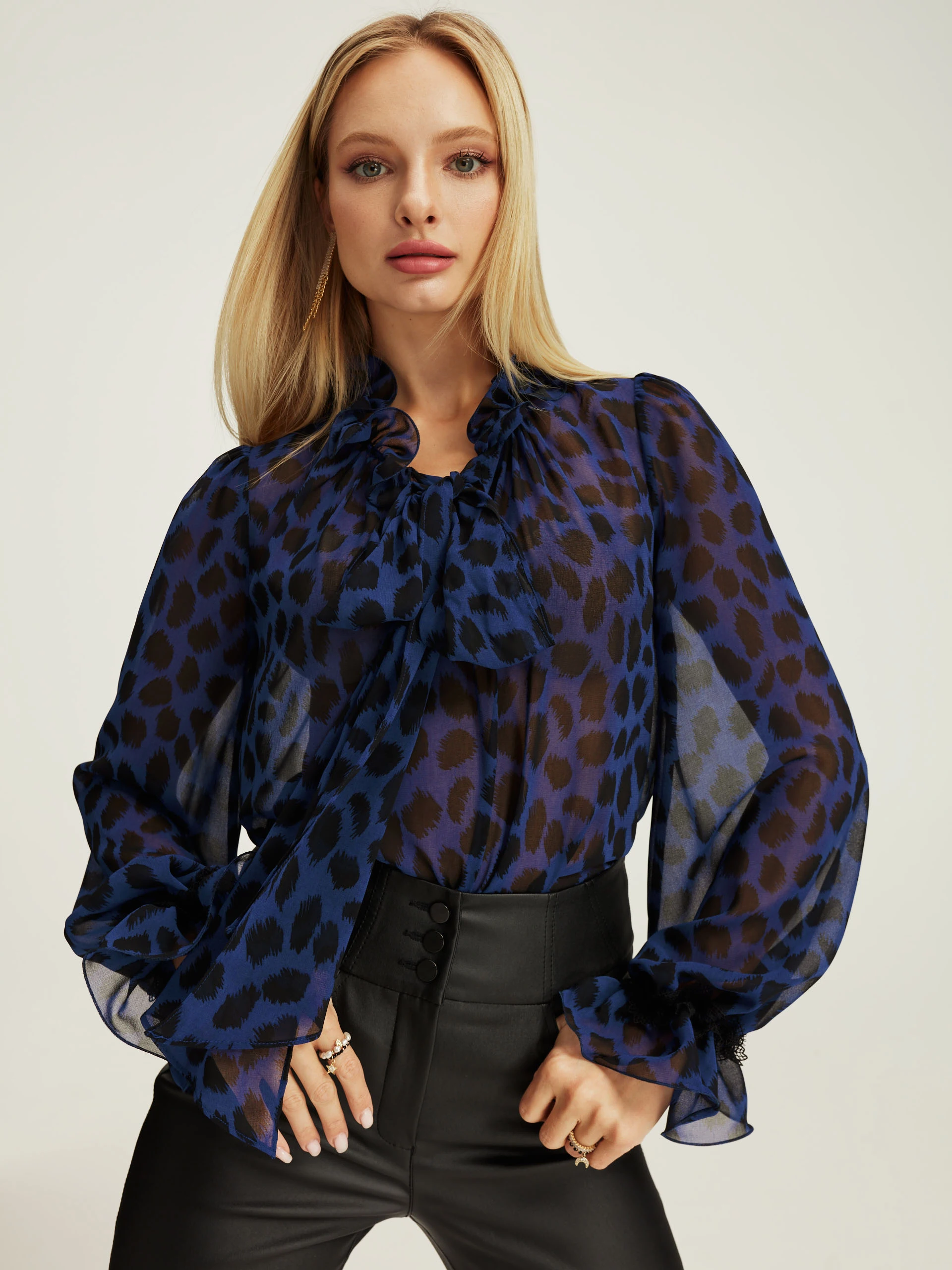 Navy blue blouse with ruffle at the neckline