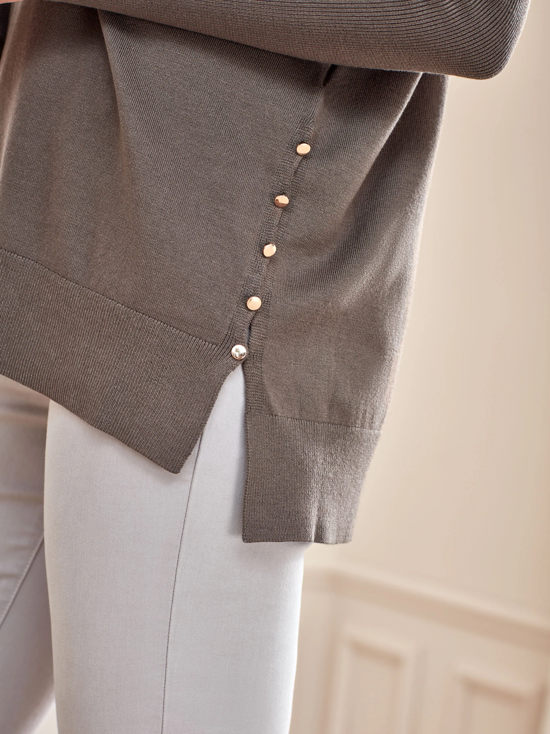 SWEATER WITH DECORATIVE BUTTONS