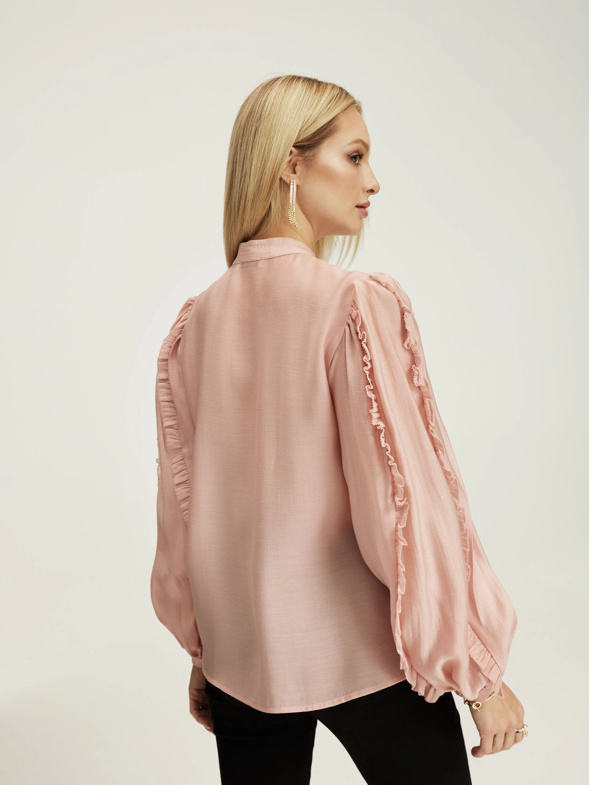 Pink blouse with ruffles on the sleeves