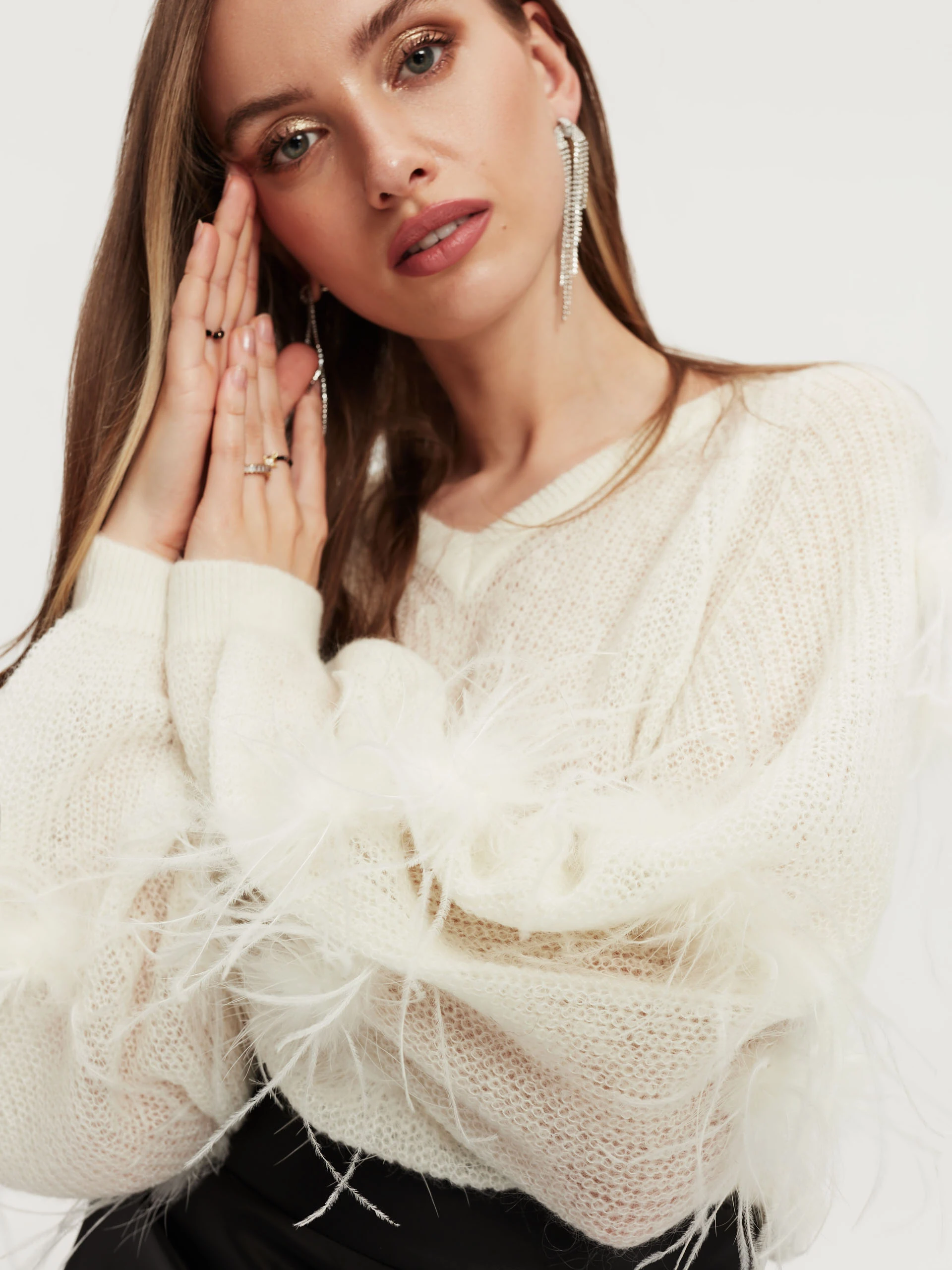 Beige sweater with ostrich feathers