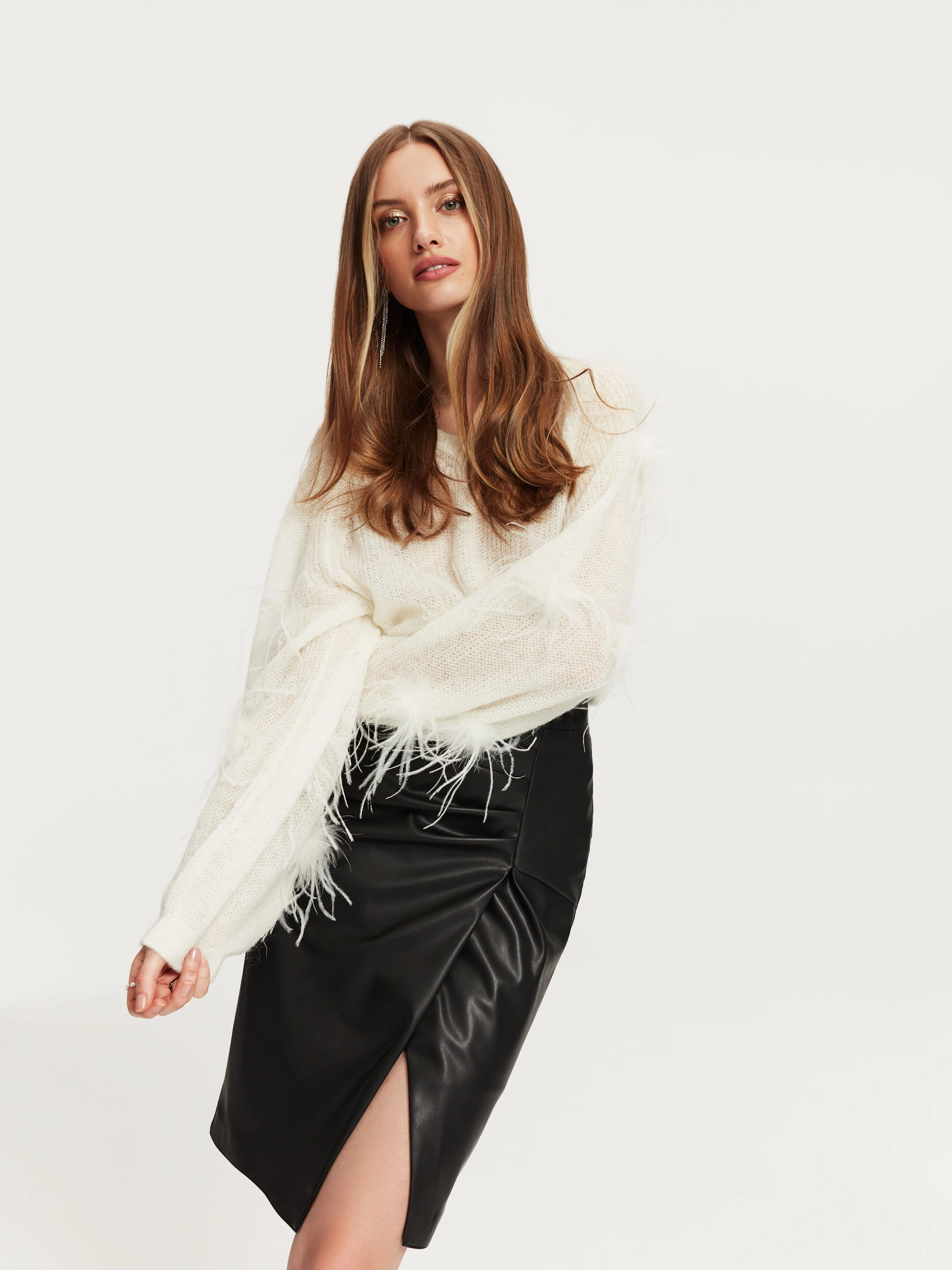 Beige sweater with ostrich feathers