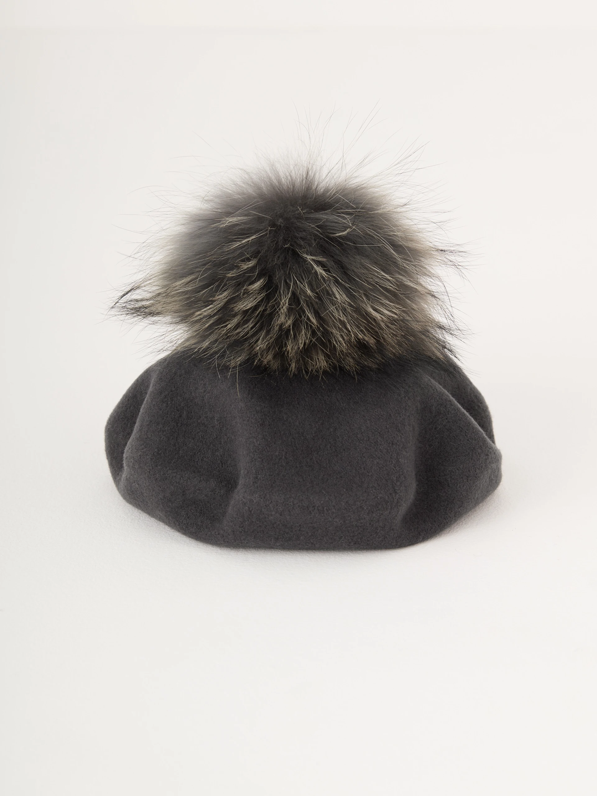 Grey beret with decorative pom-pom