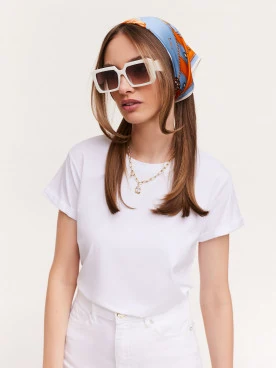 White blouse with a heart on the back