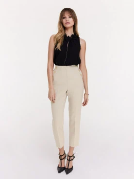 Beige cigarette pants with decorative buttons