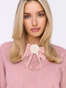 Brooch in the shape of a bow with a flower and a pendant