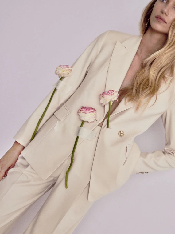 Cream suit jacket with decorative buttons