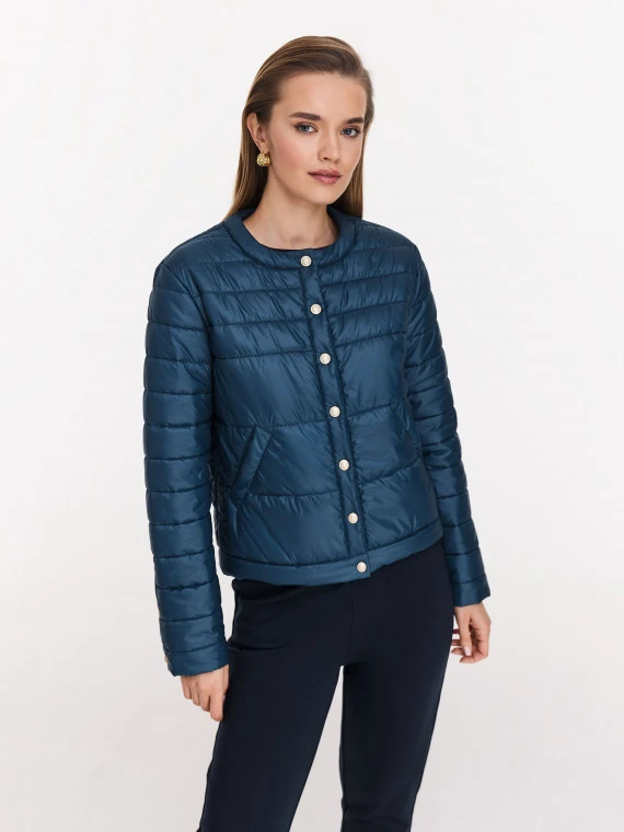 Navy blue quilted jacket with decorative buttons