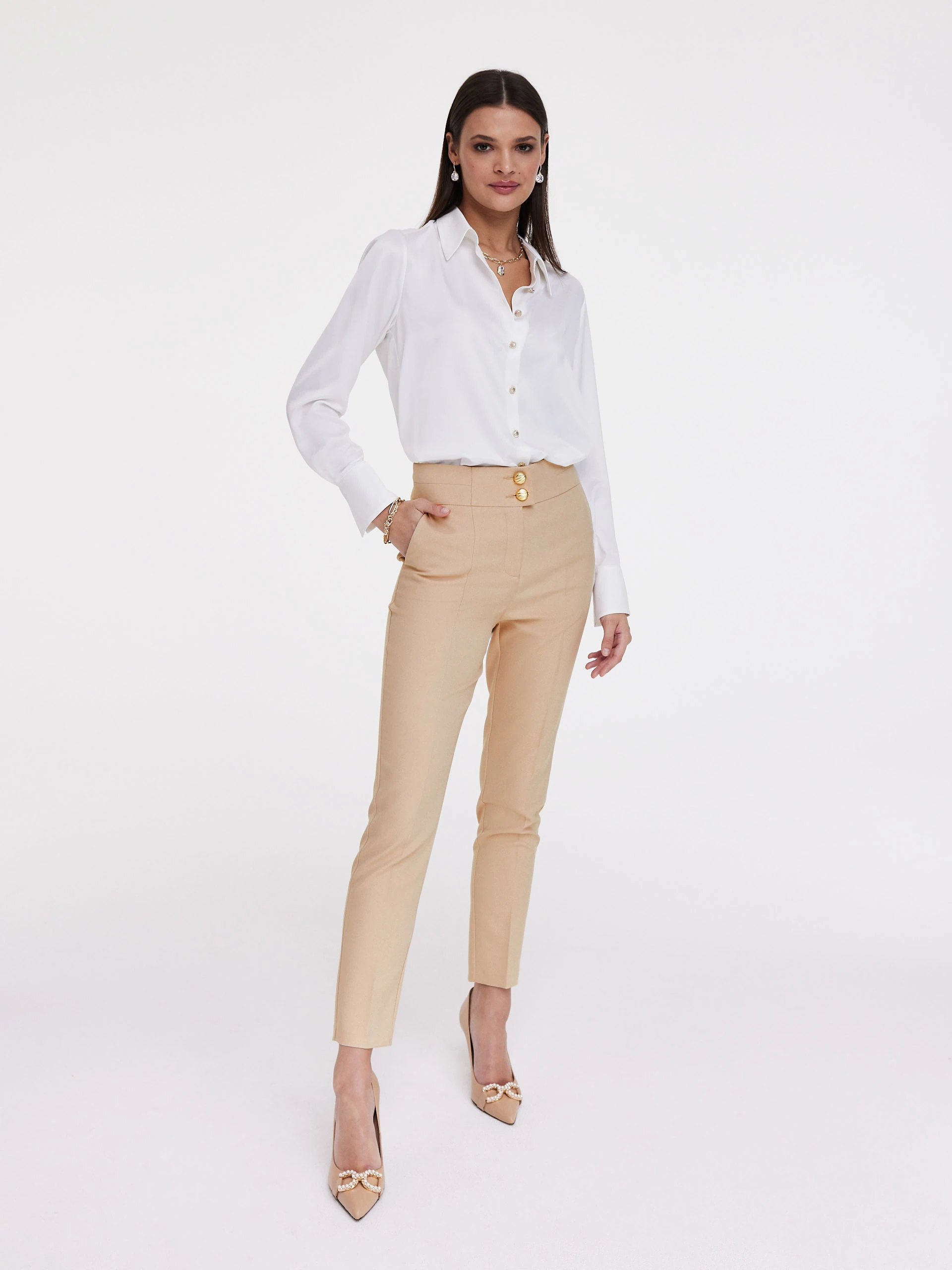 Beige cigarette pants with gold buttons