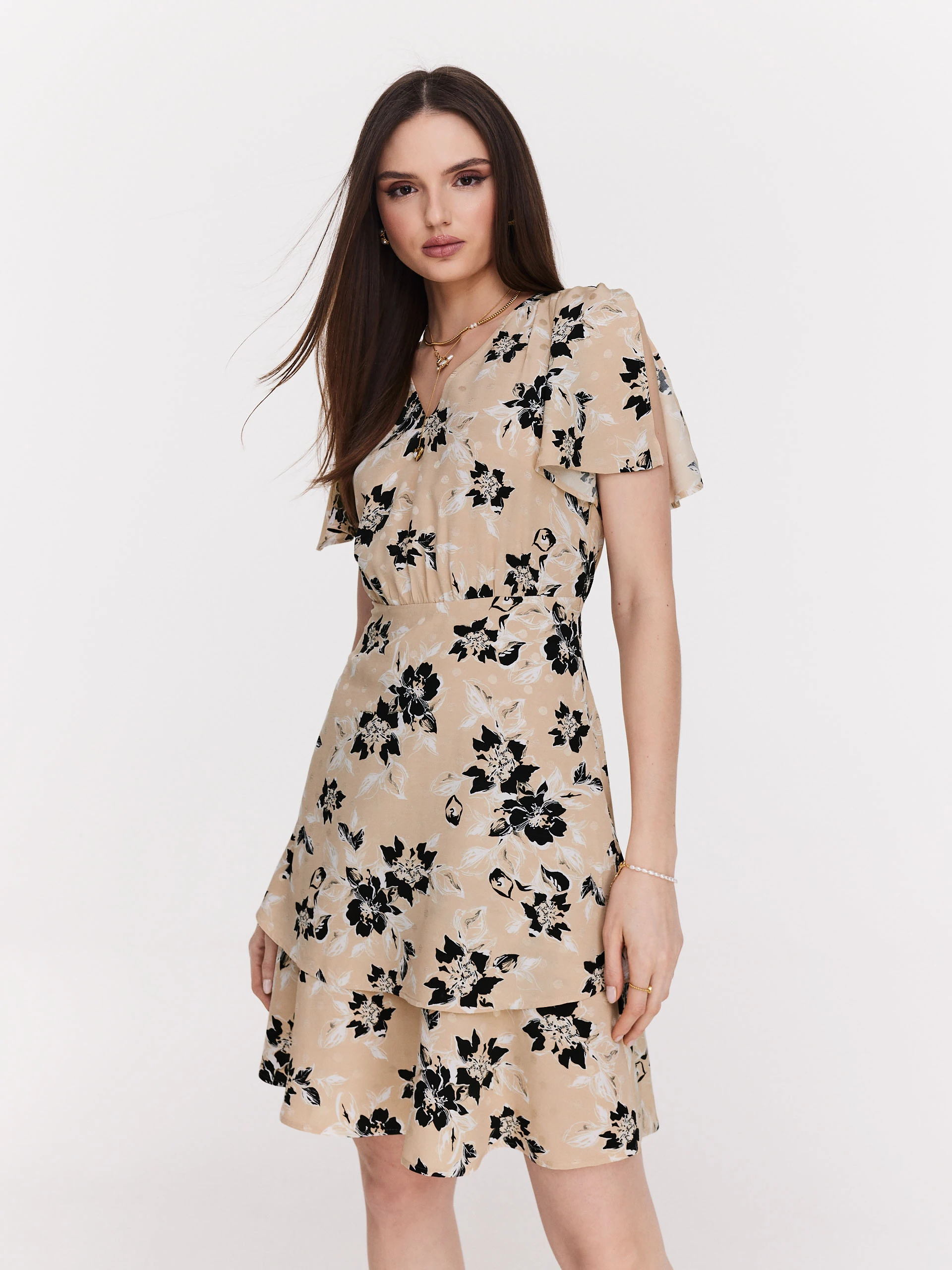 Beige airy dress with black flowers