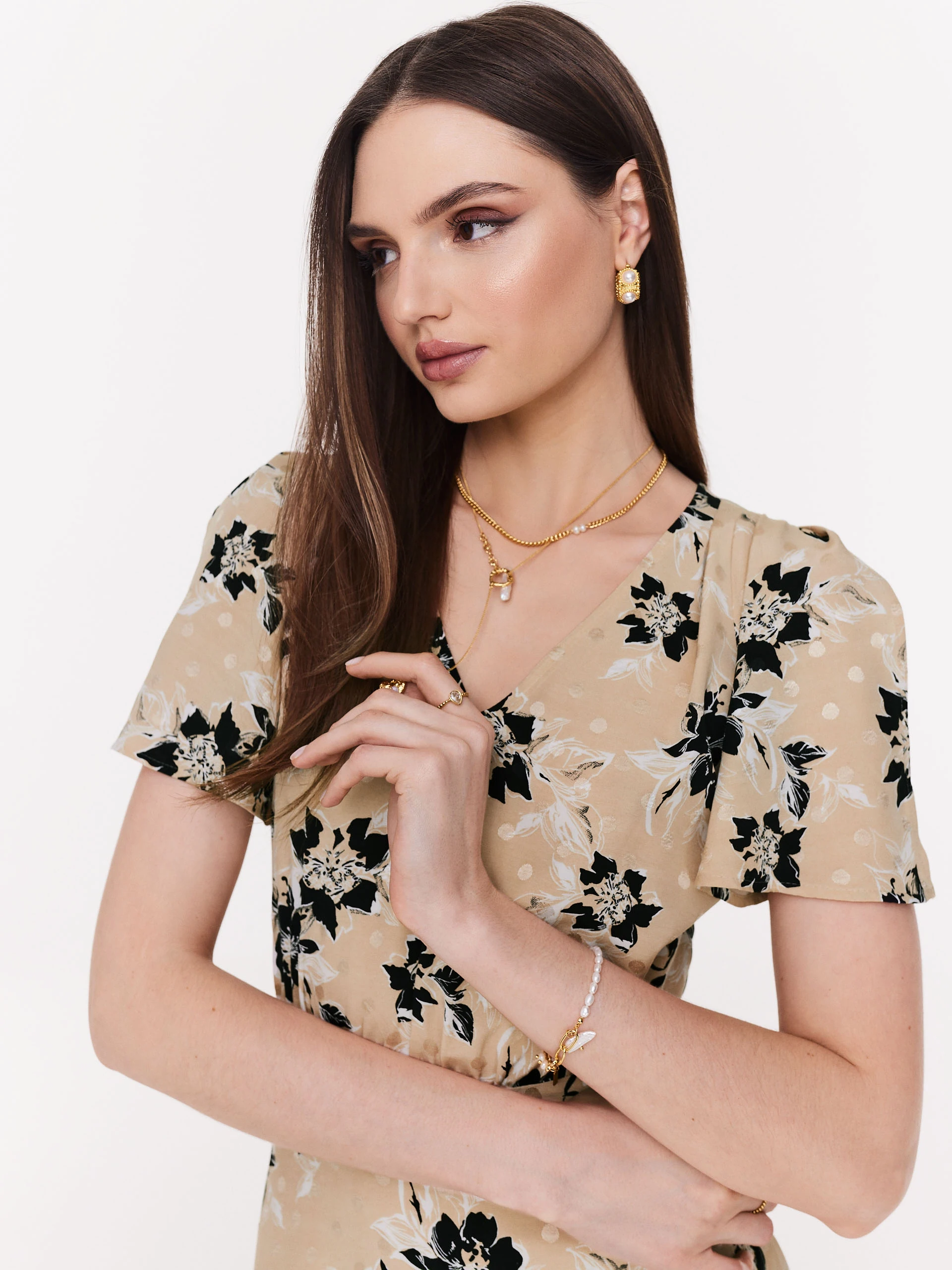 Beige airy dress with black flowers