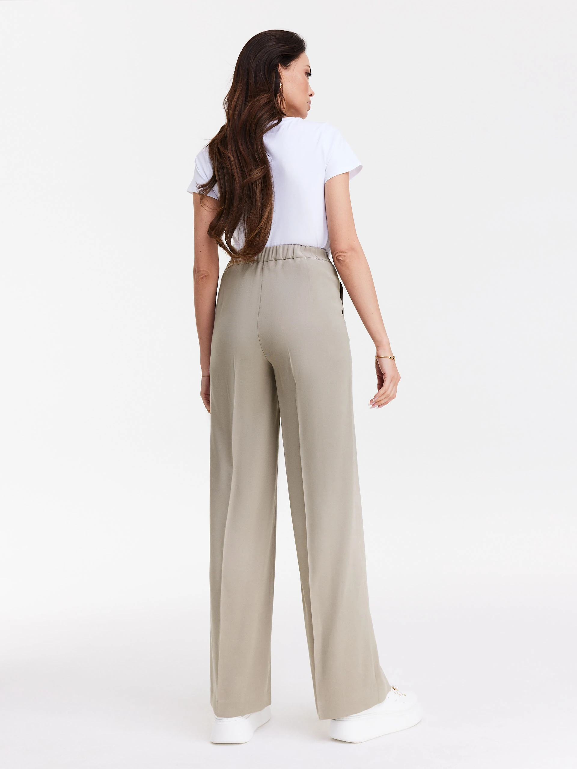 Beige pants with wide legs