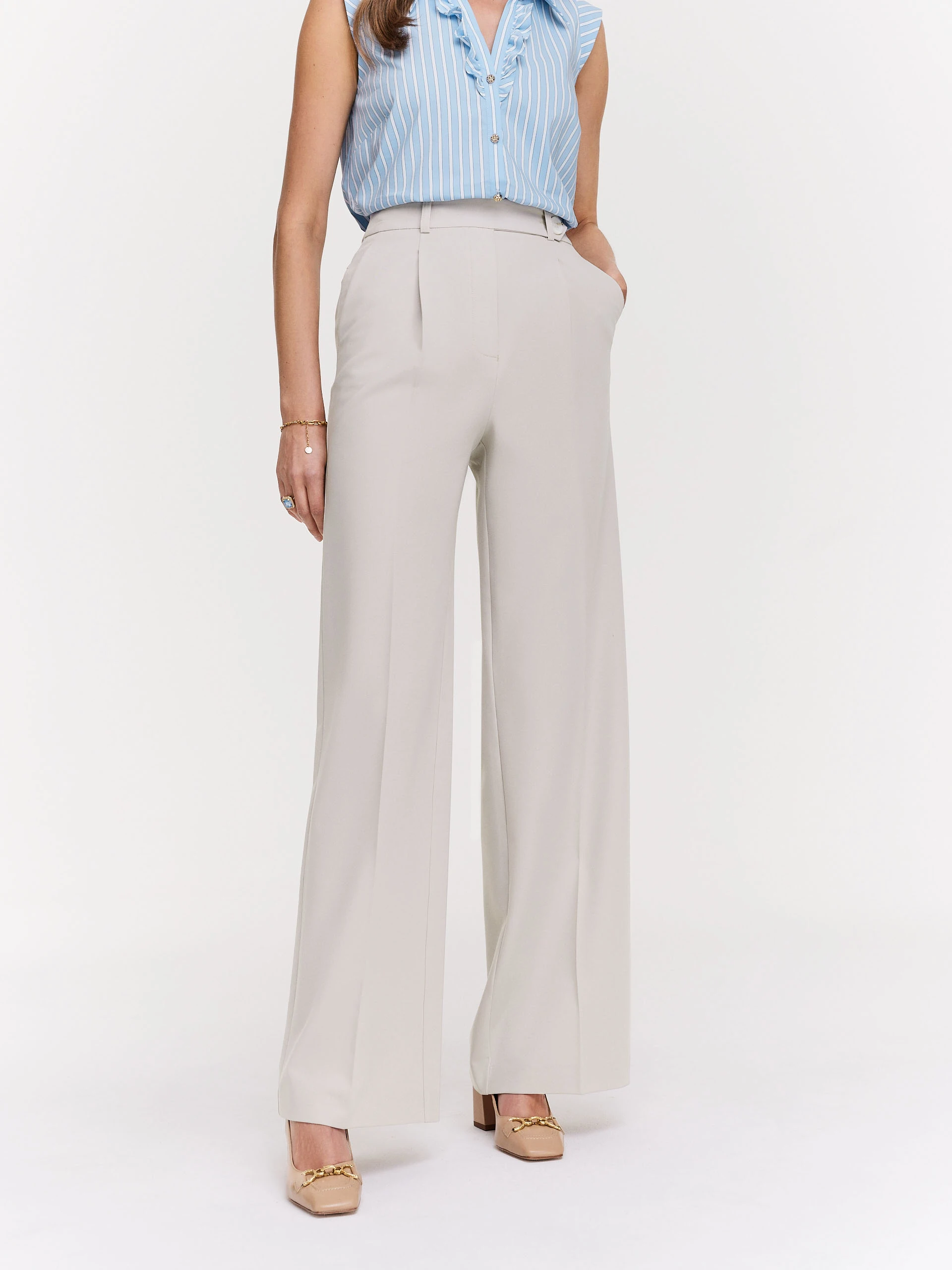 Beige pants pressed at the edge