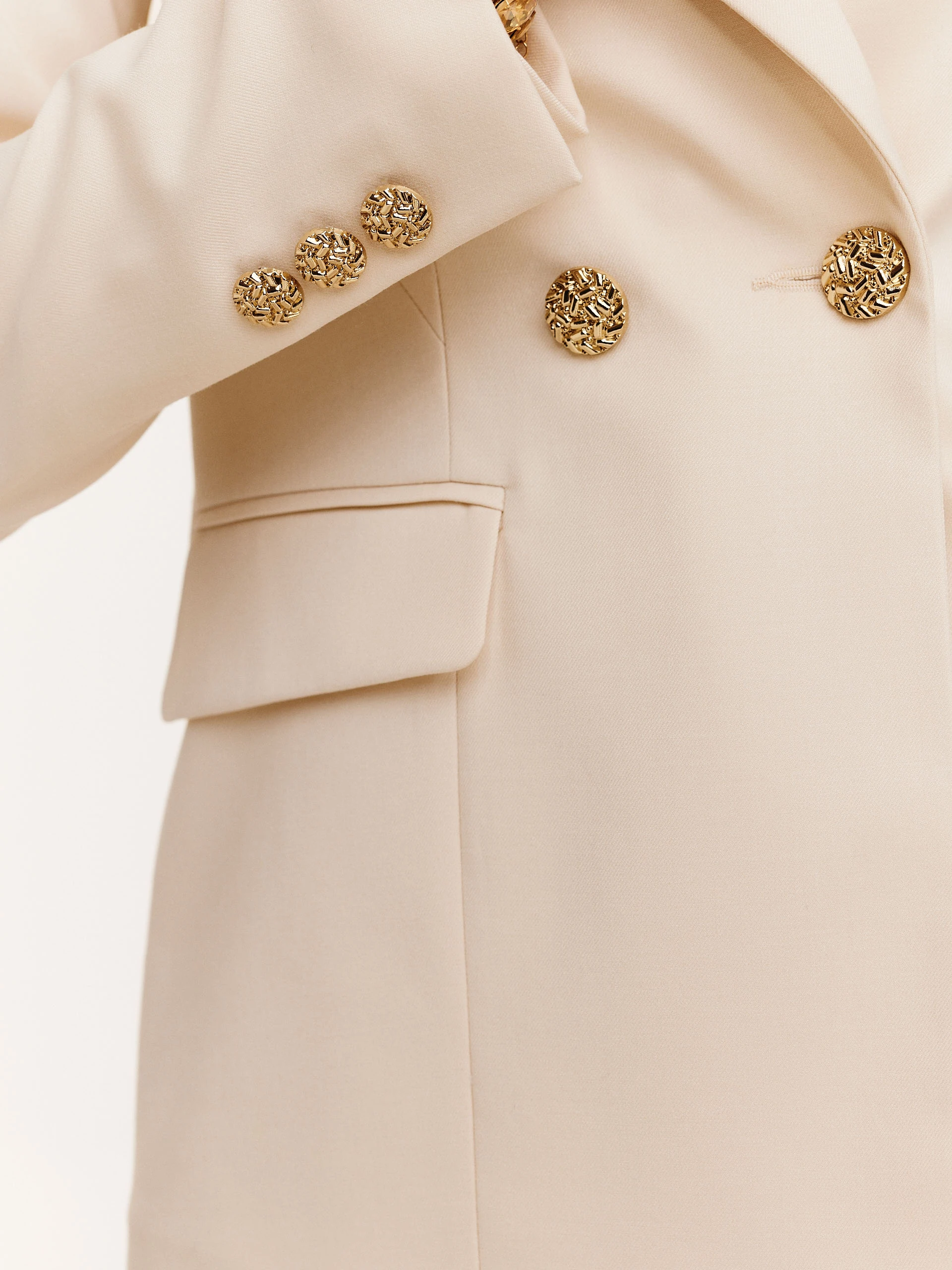 Cream suit jacket with decorative buttons