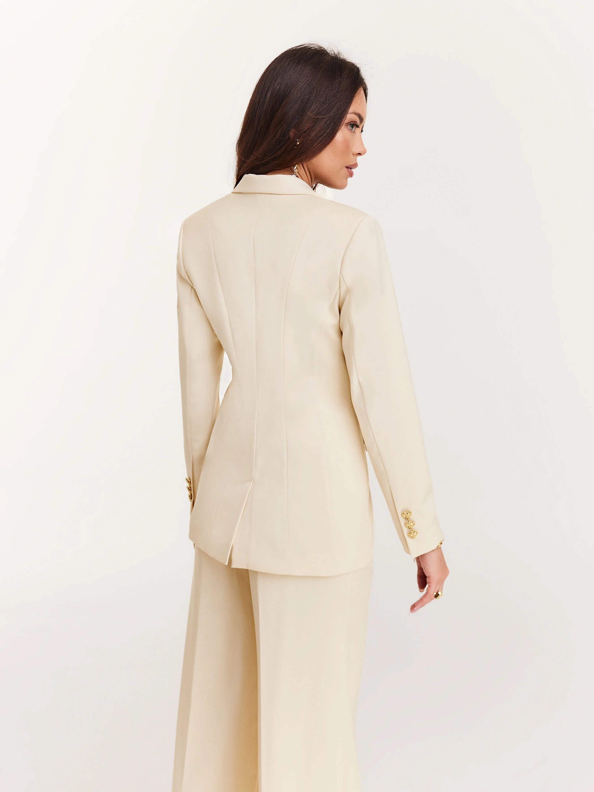 Cream suit jacket with decorative buttons
