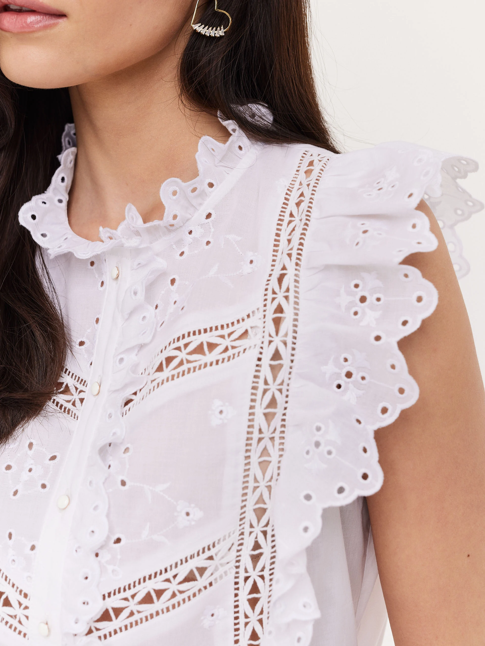 White blouse with openwork inserts