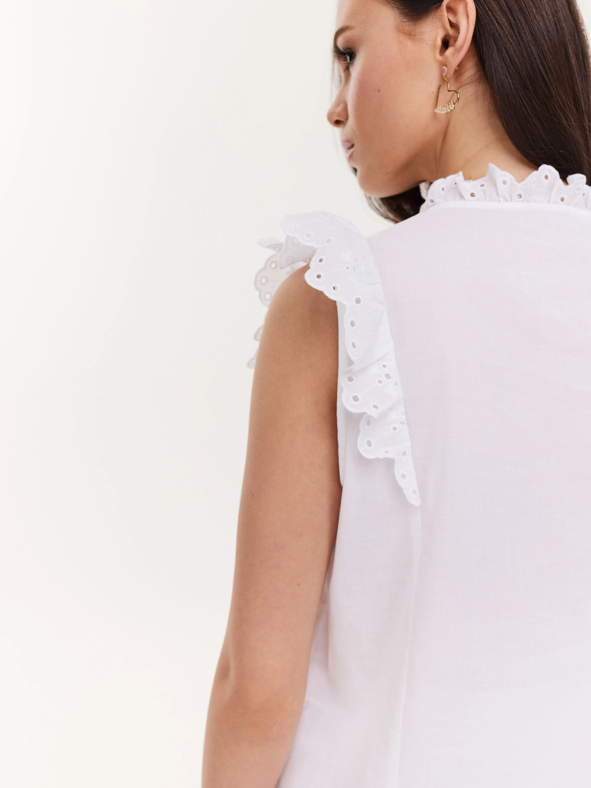 White blouse with openwork inserts
