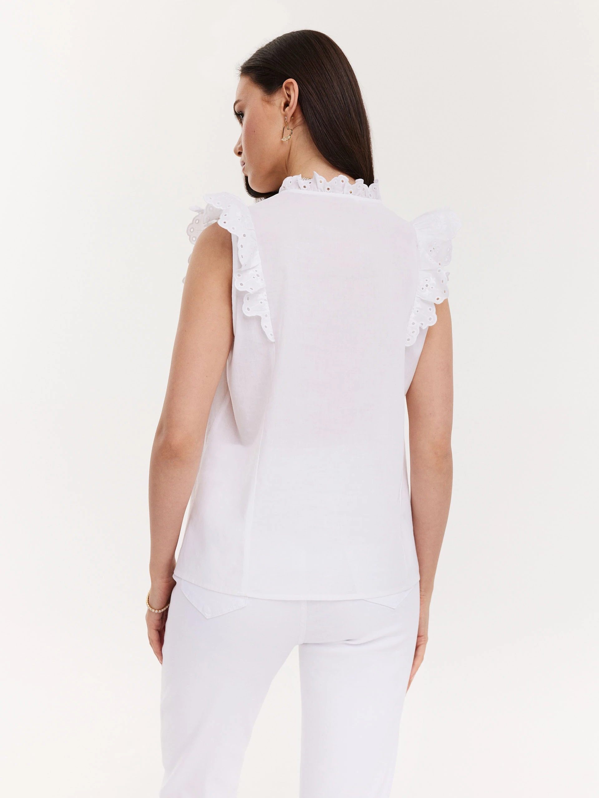 White blouse with openwork inserts