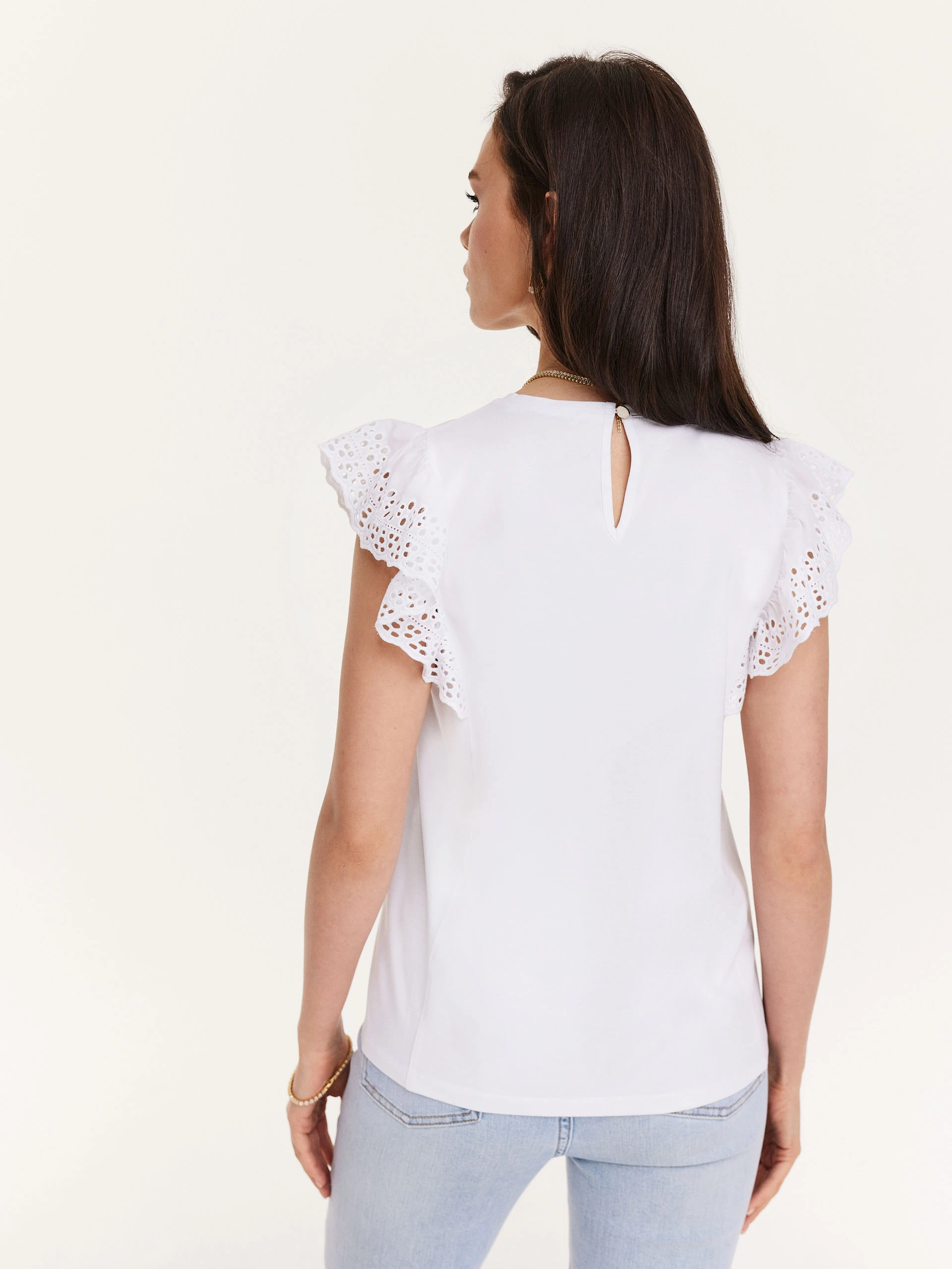 White blouse with openwork inserts