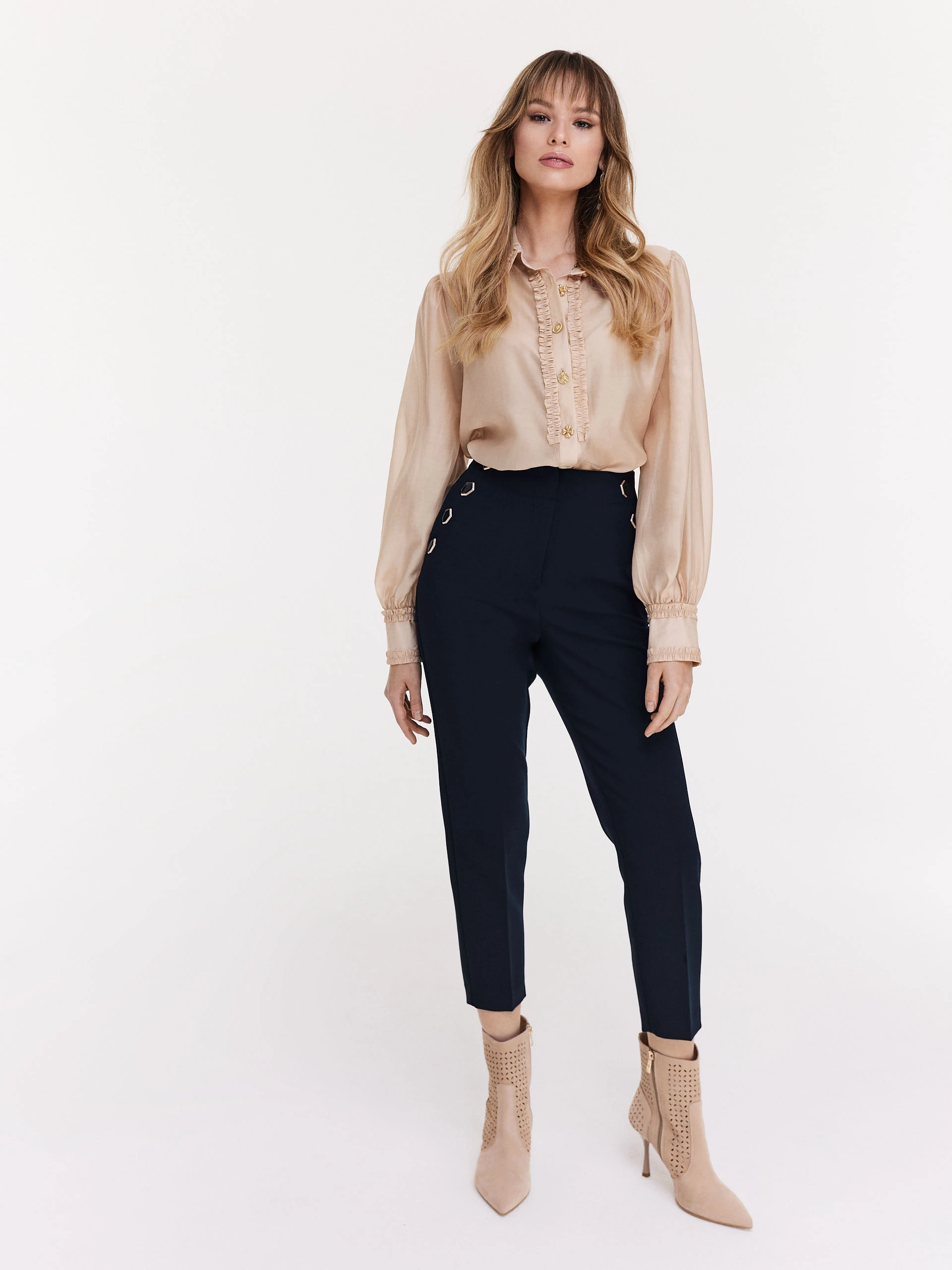 Navy blue cigarette pants with decorative buttons