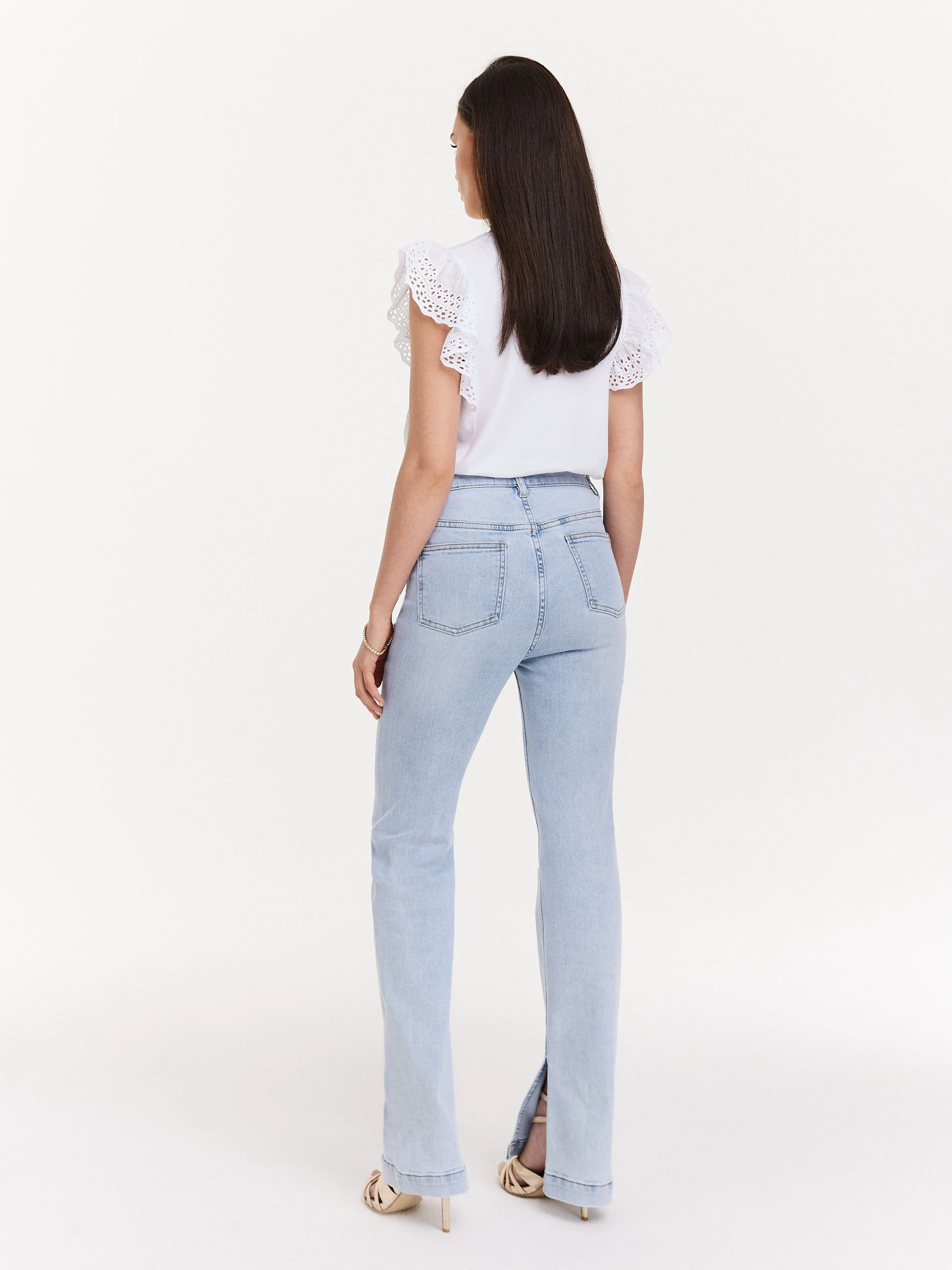 Light denim pants with slits