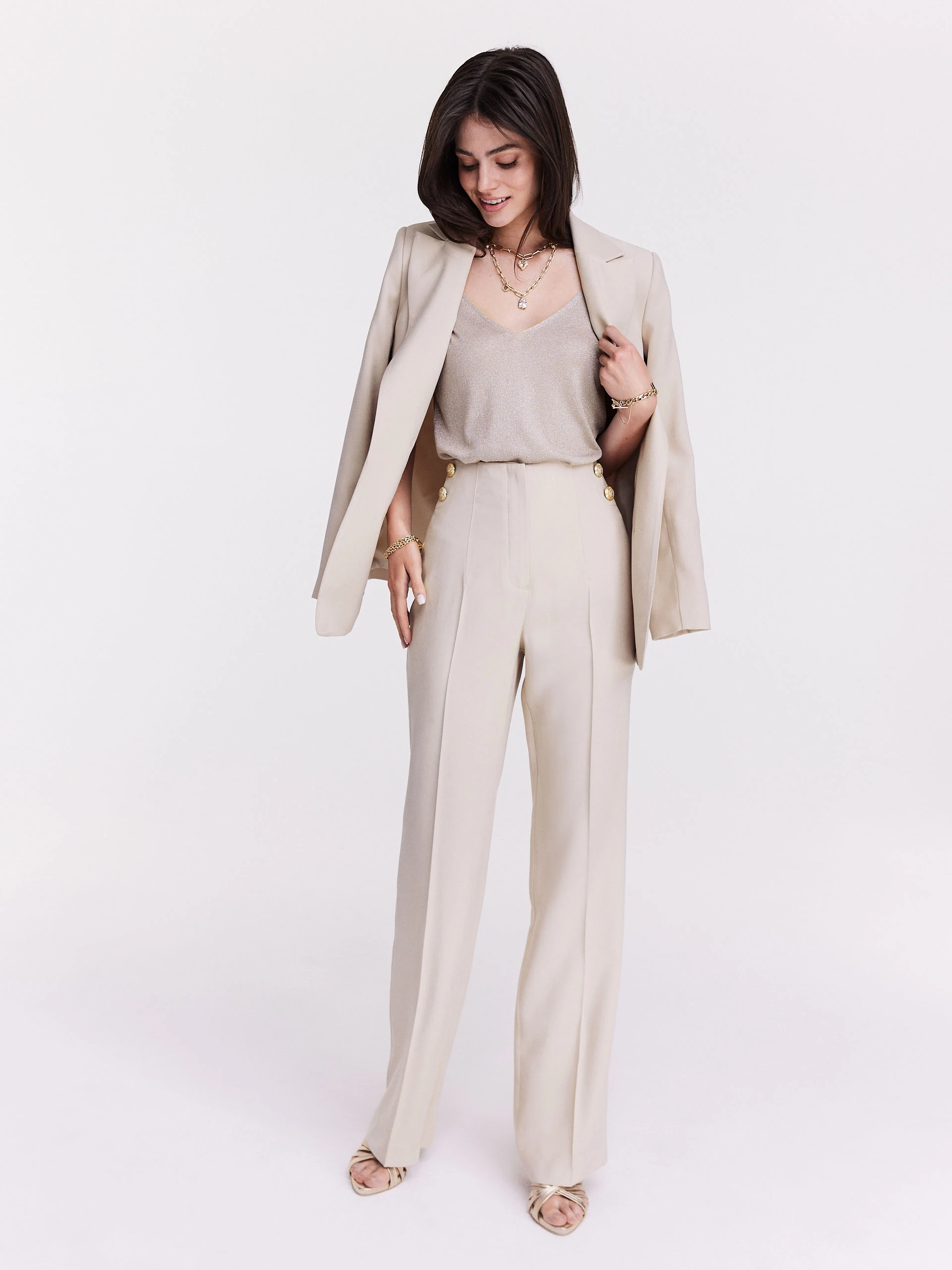 Knitted sleeveless jacket in beige color