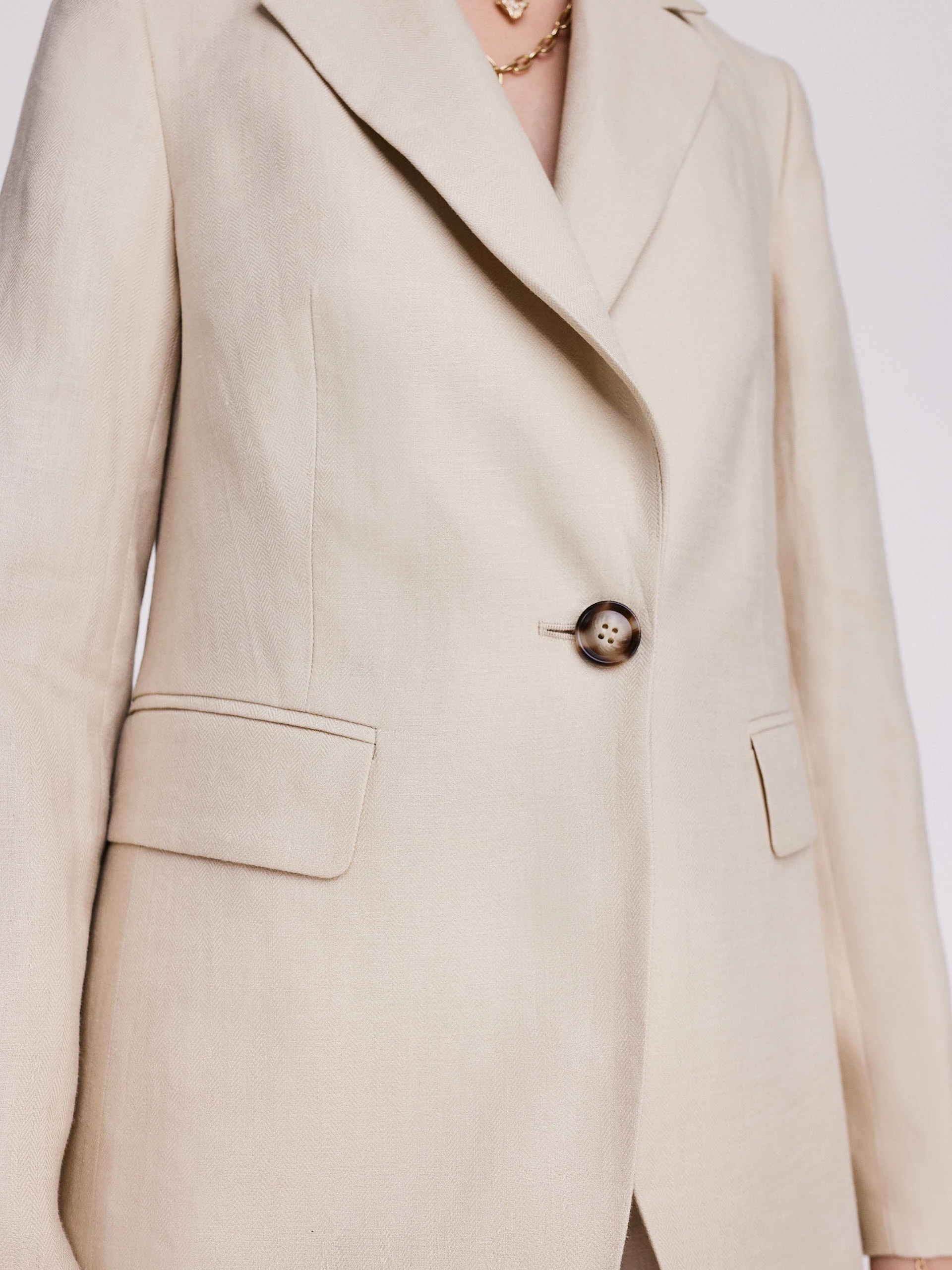 Beige linen jacket with a classic cut