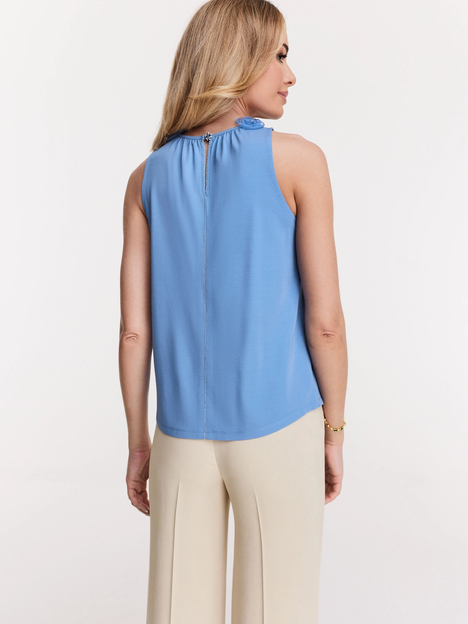 Blue blouse with roses on the neckline
