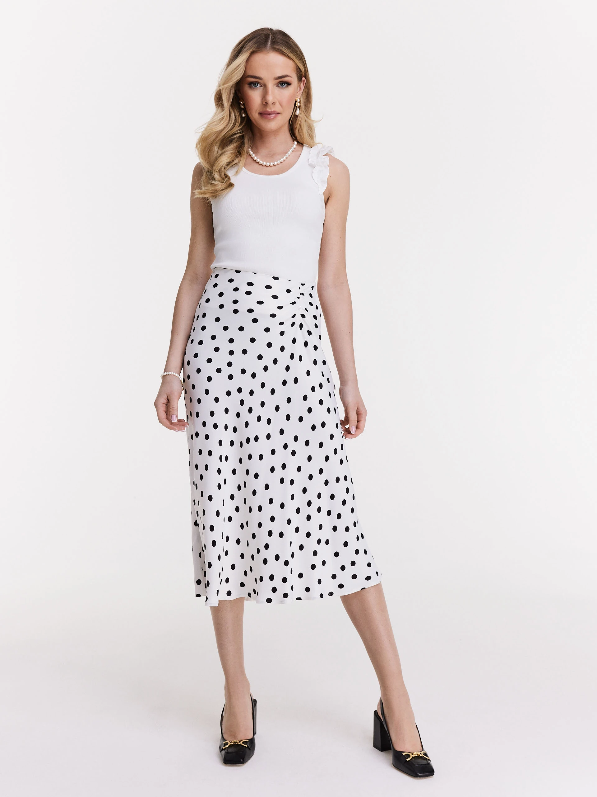 White top with shoulder strap embellishments