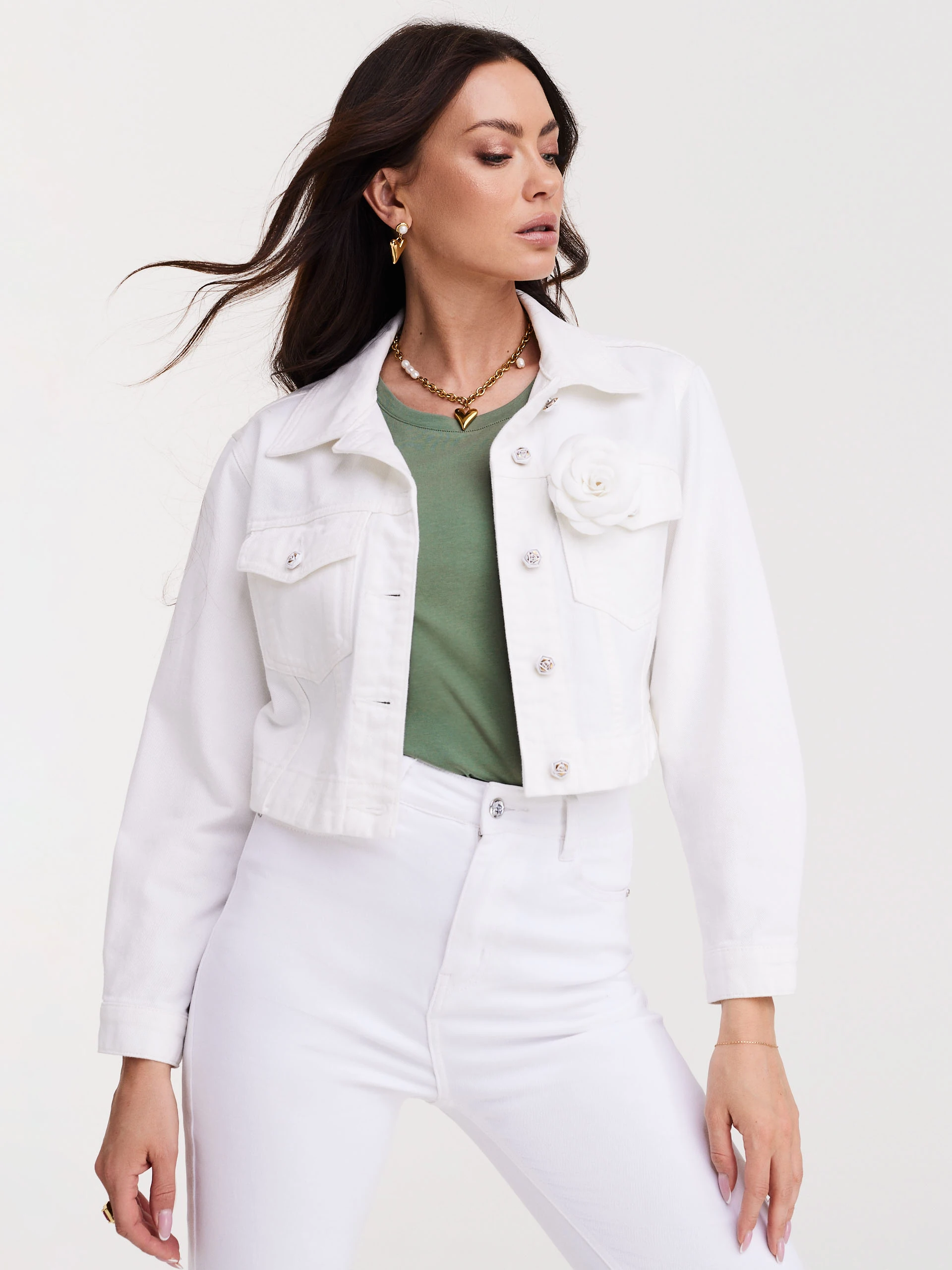 Short white jacket with decorative buttons and rose