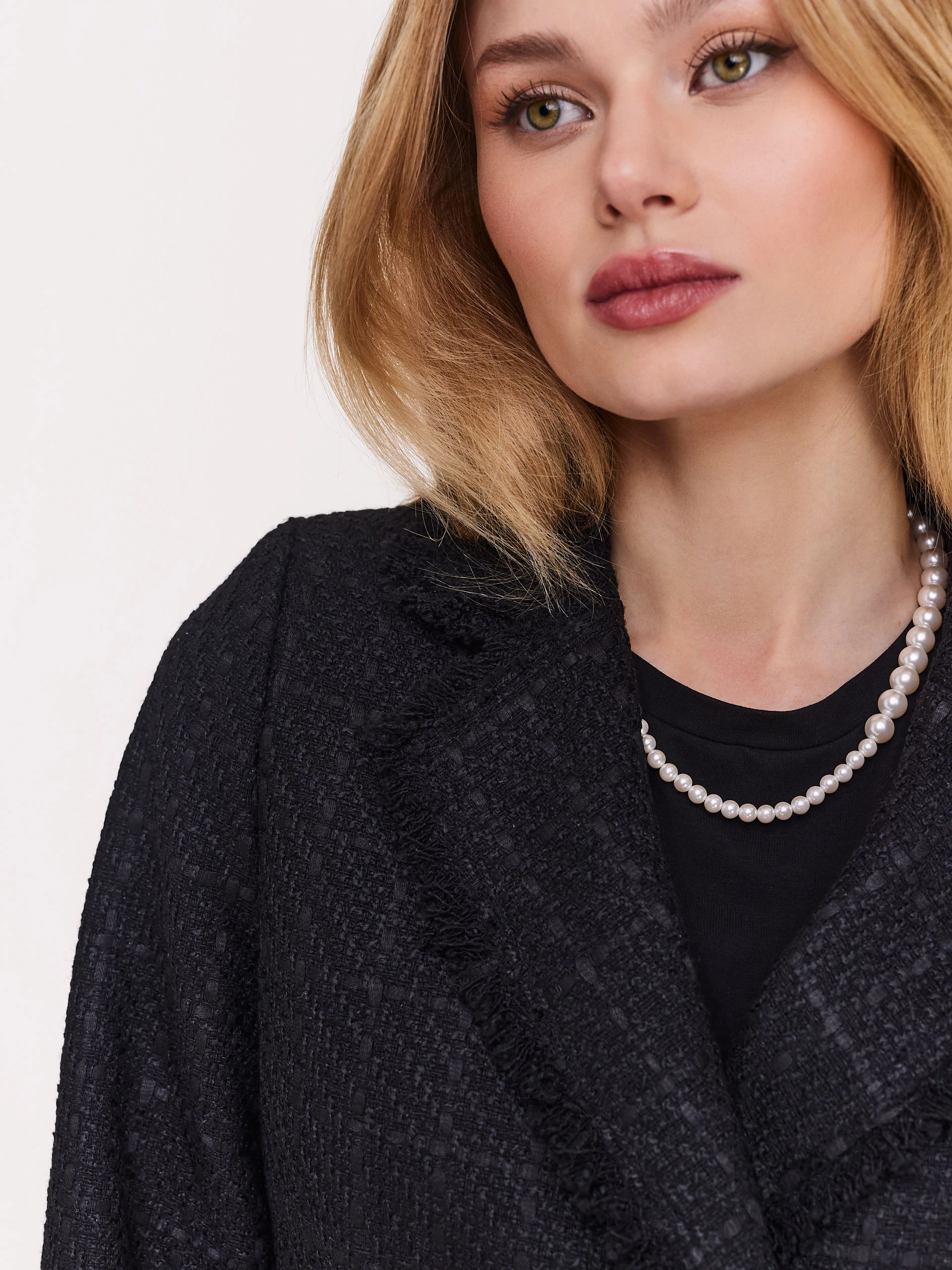 Black bouclé fabric coat