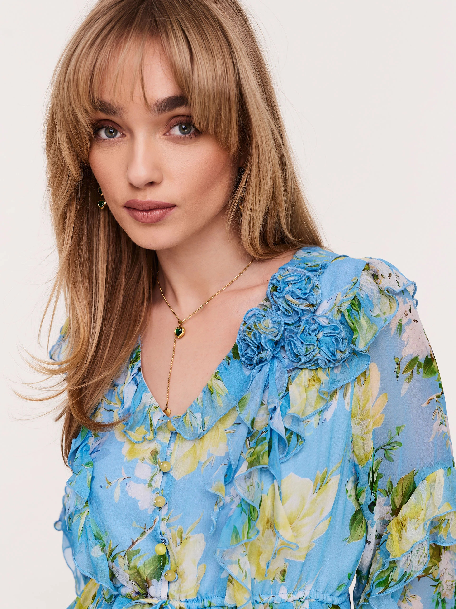 Blue dress with frills in yellow flowers
