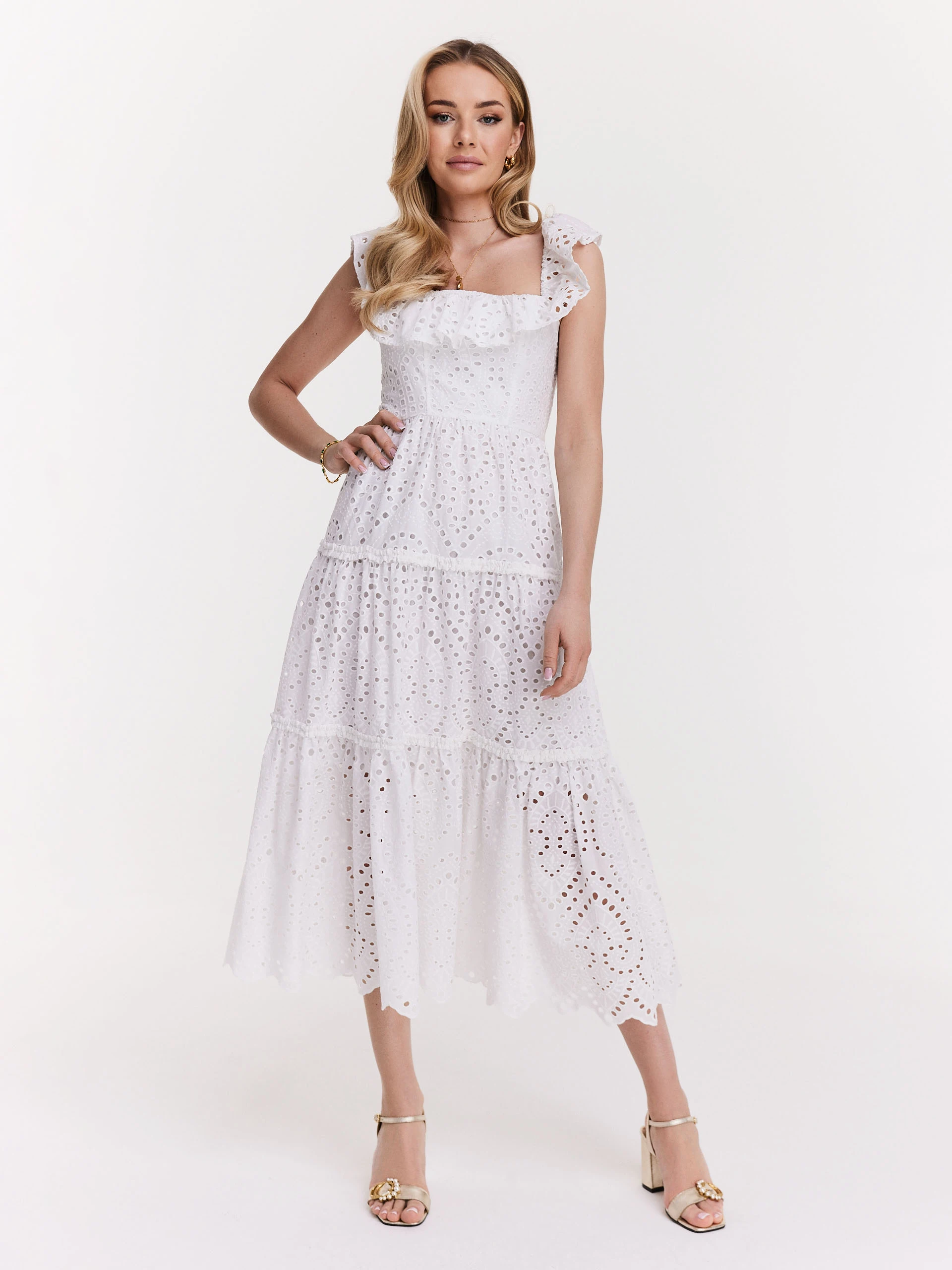Delicate dress made of thin embellished fabric