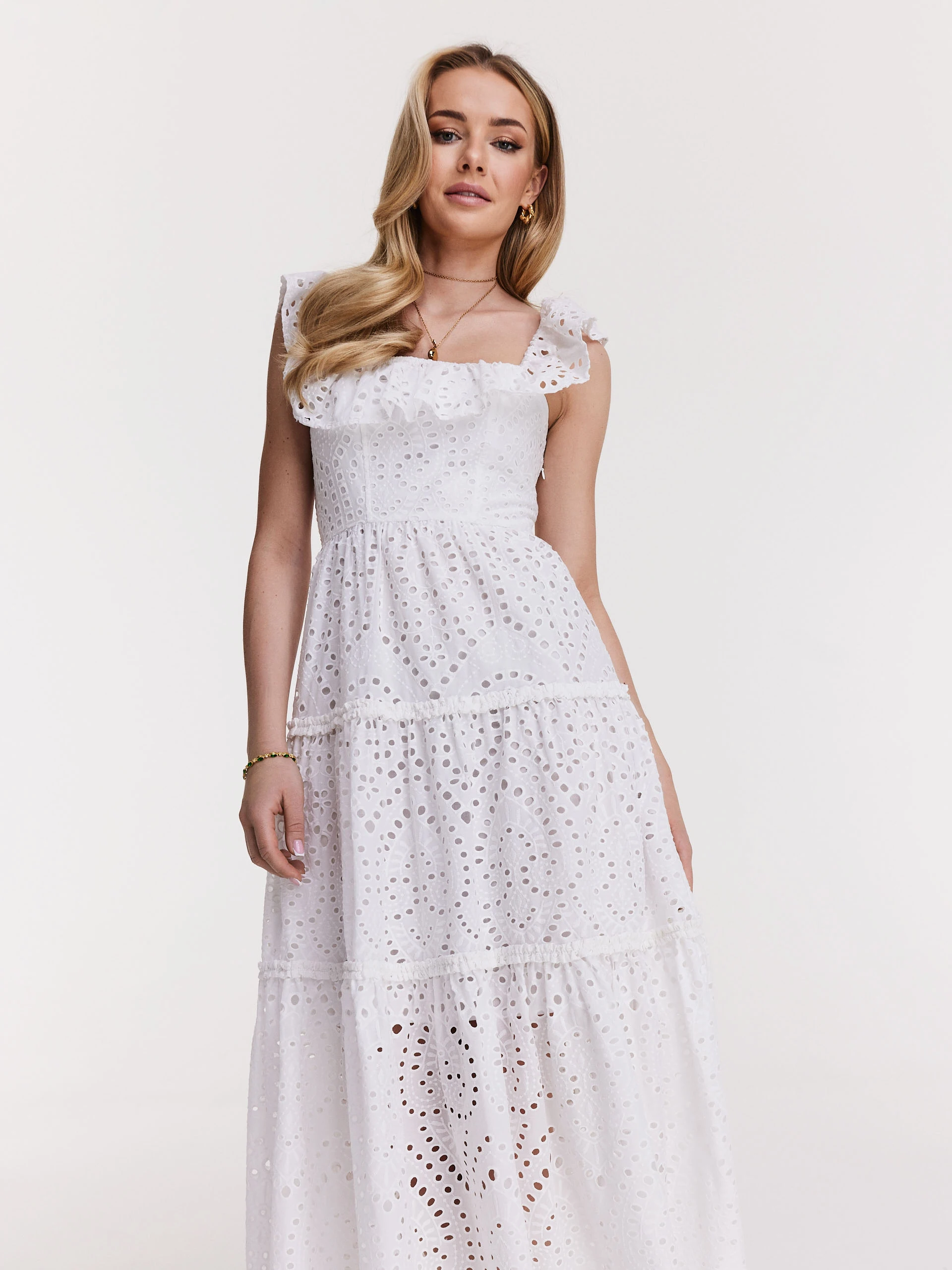 Delicate dress made of thin embellished fabric