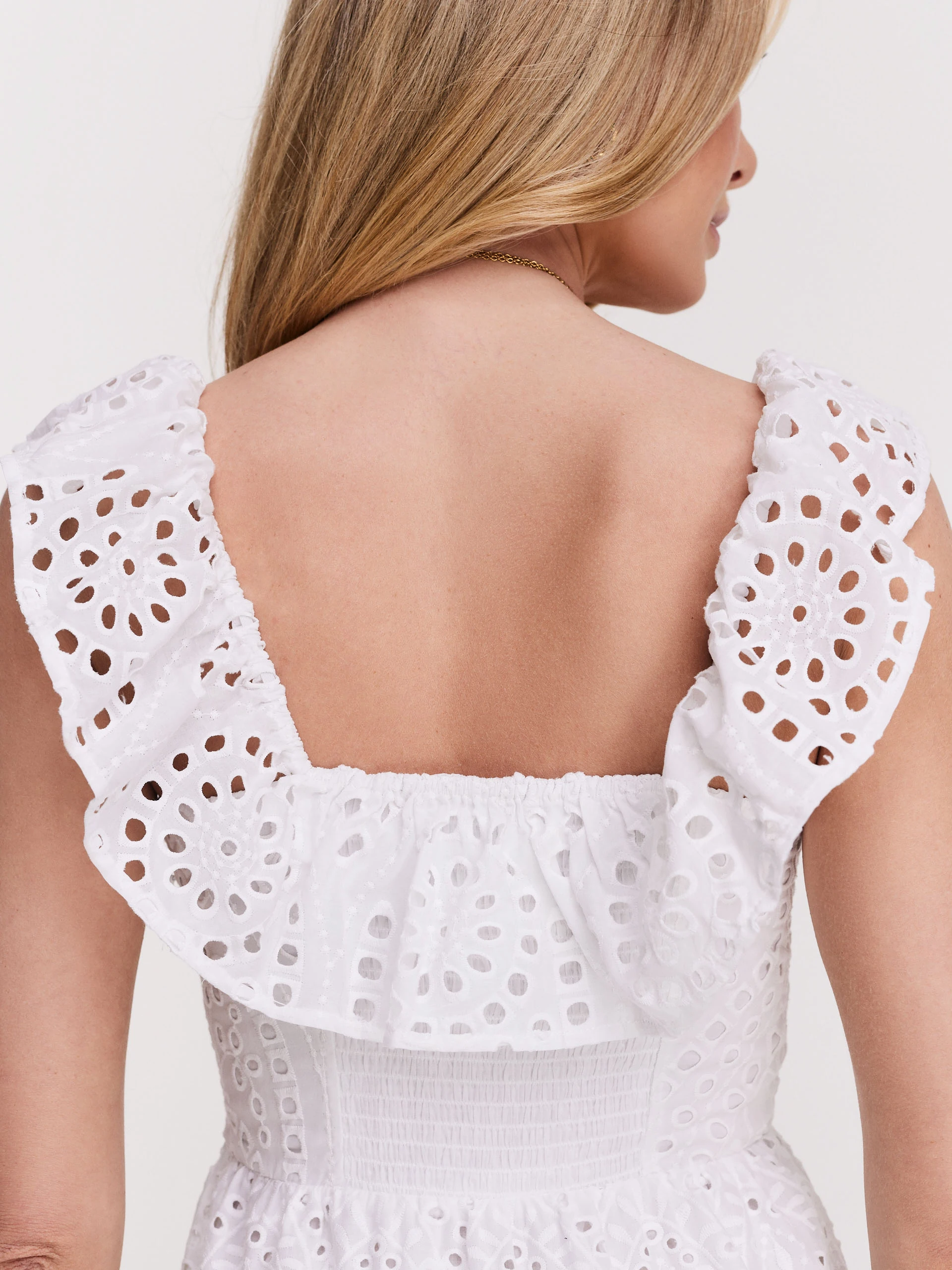 Delicate dress made of thin embellished fabric