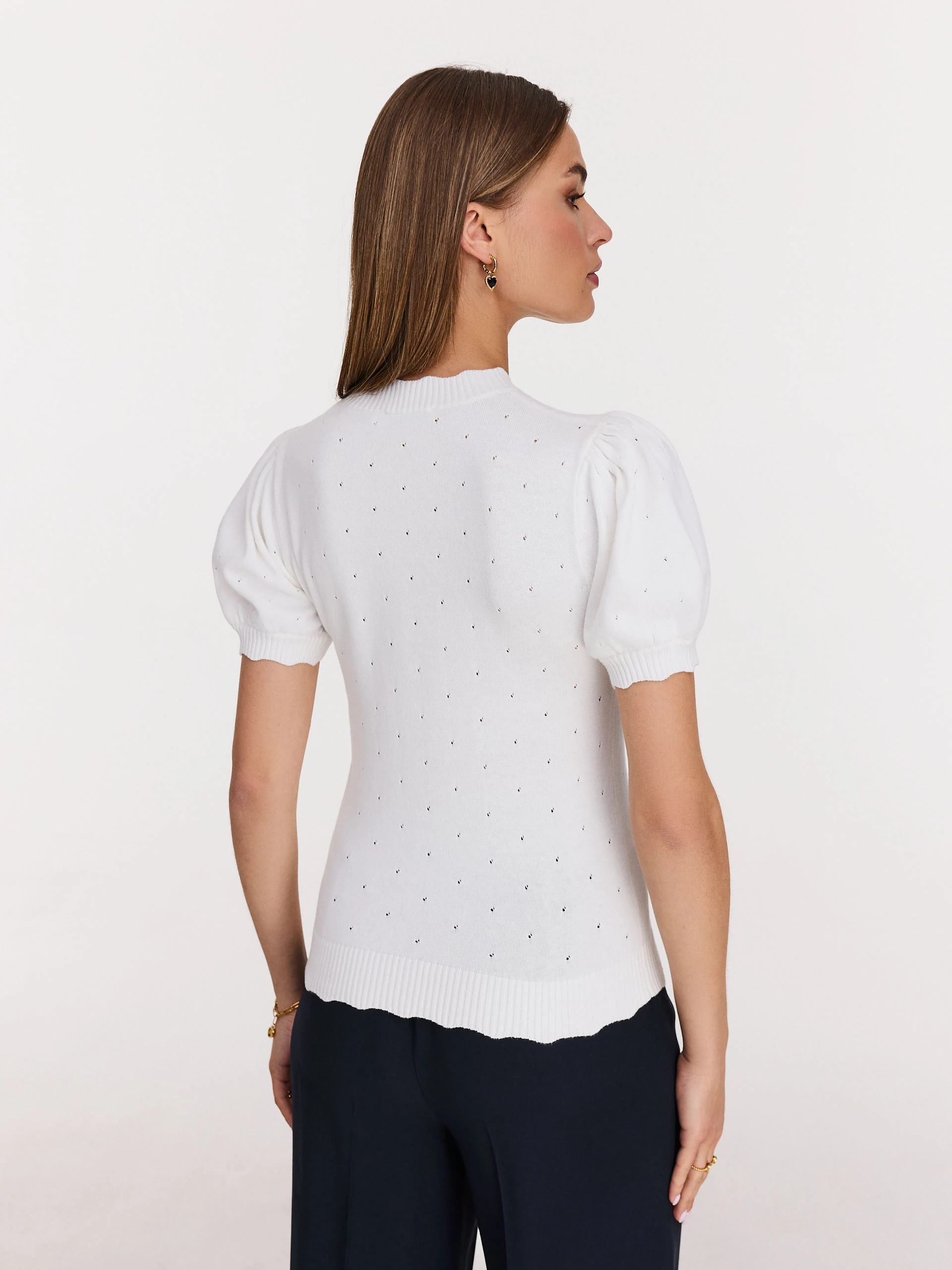 White buffet sweater with openwork embellishments