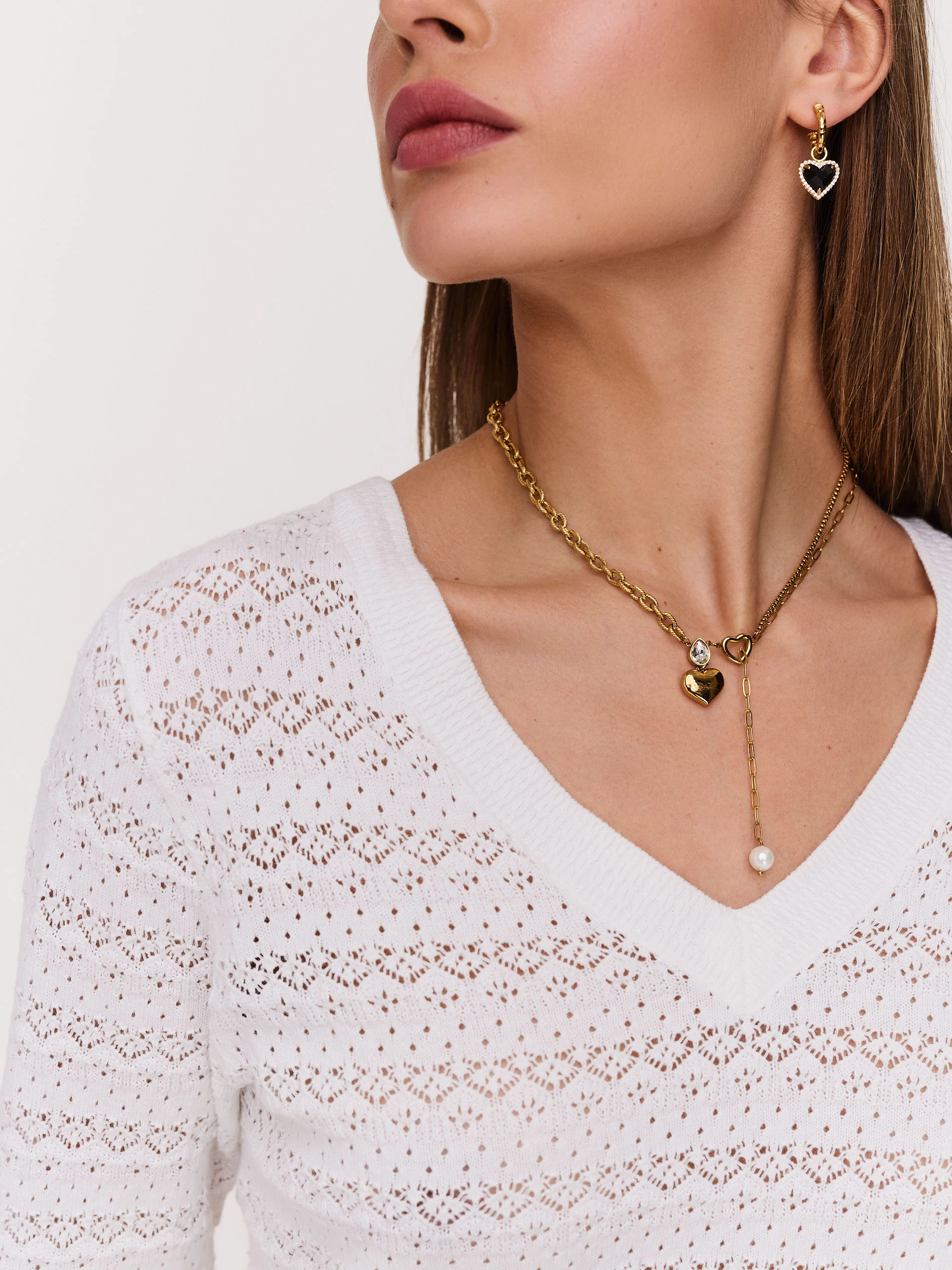 Openwork white sweater with V neckline