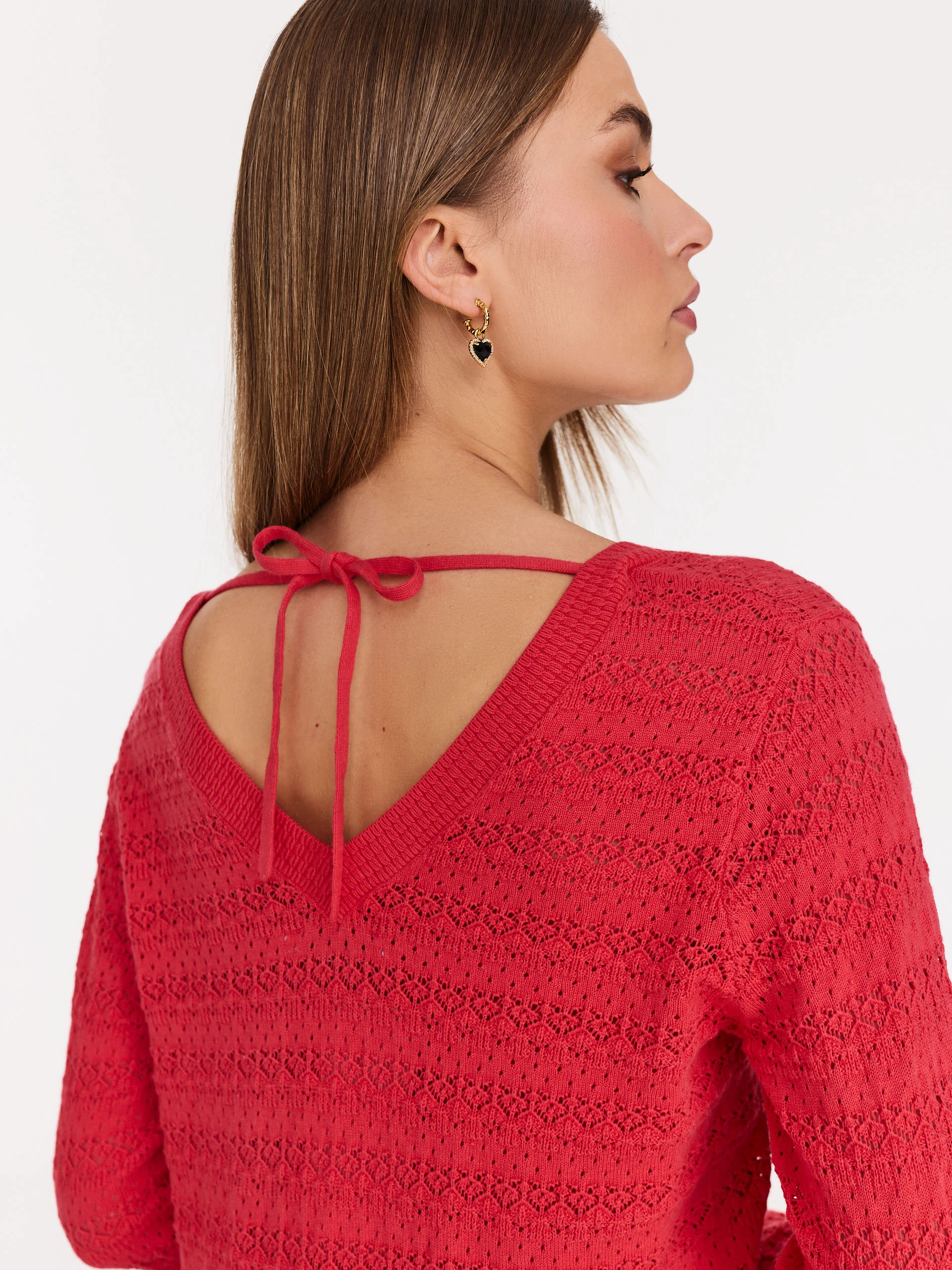 Red openwork sweater with V neckline