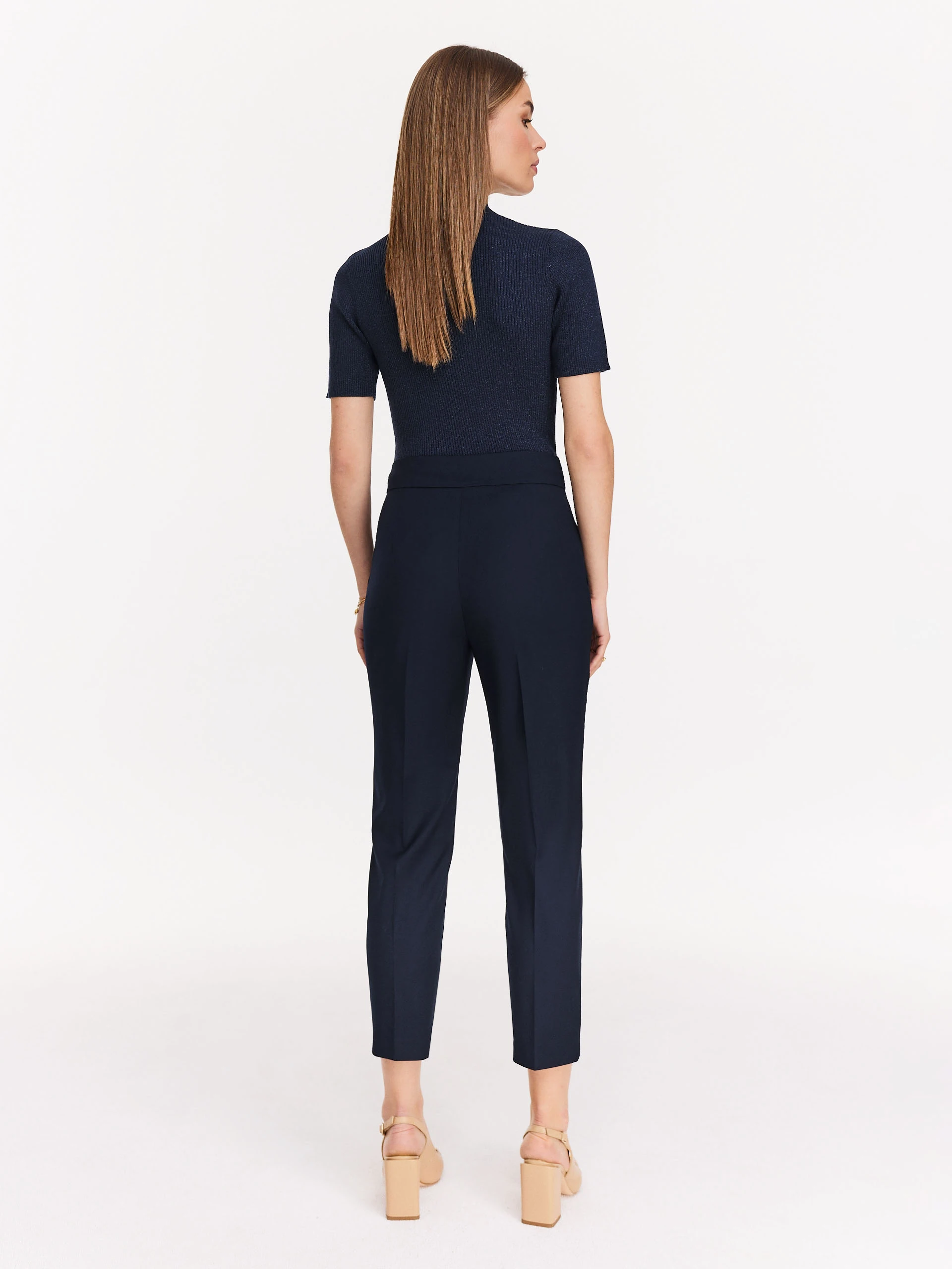 Navy blue sweater with floral appliqué