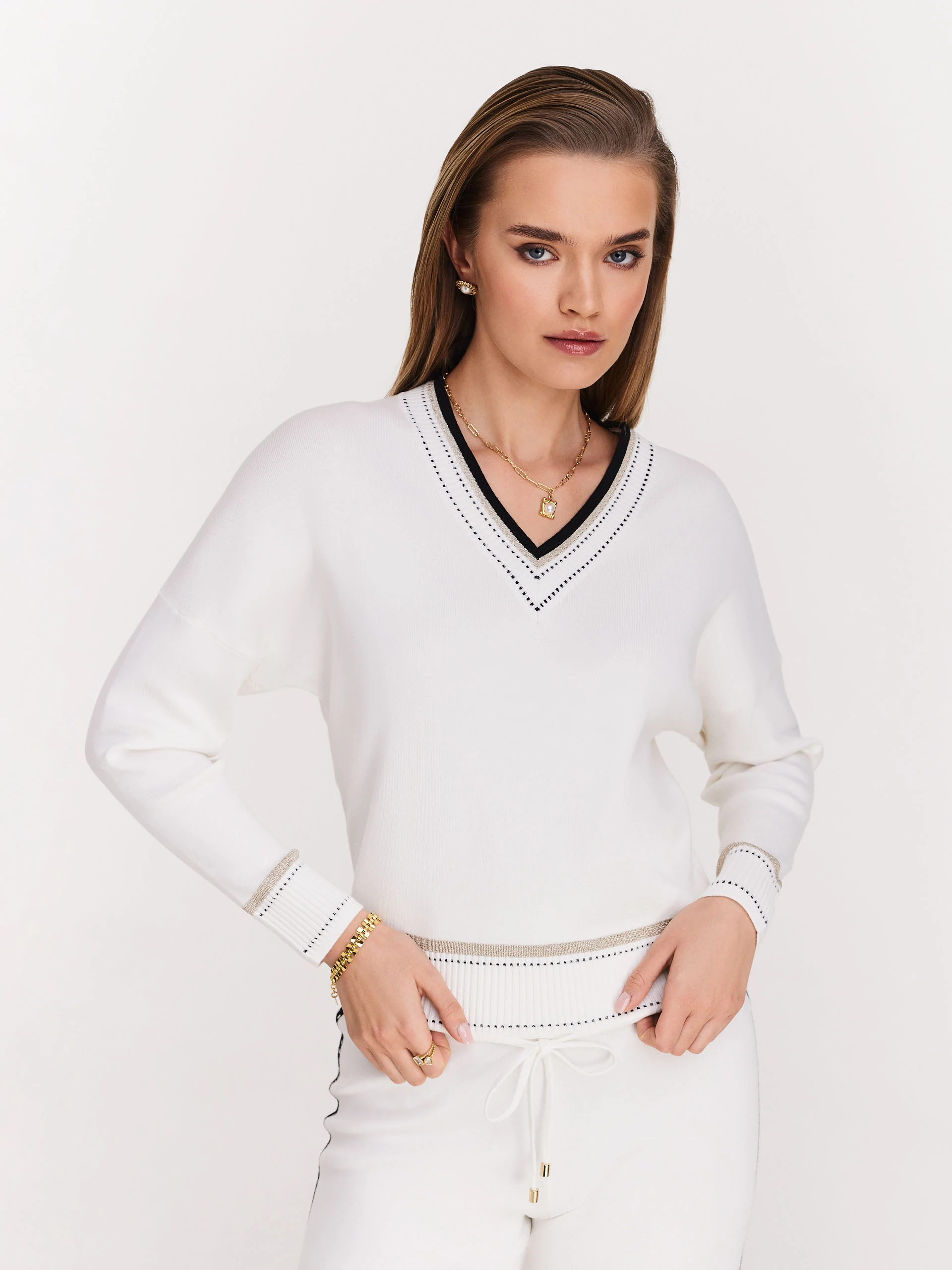 Cream sweater with V neckline