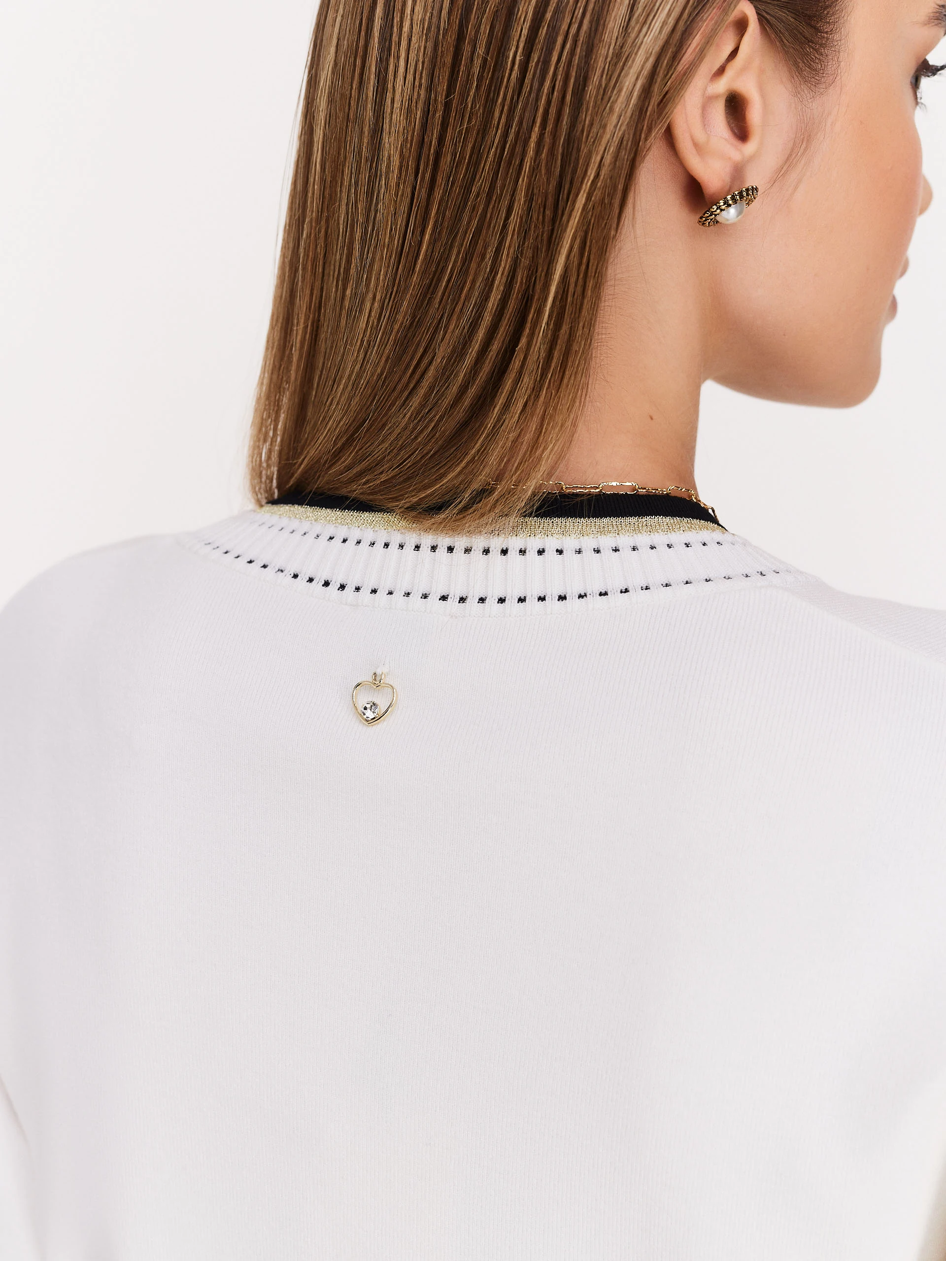 Cream sweater with V neckline