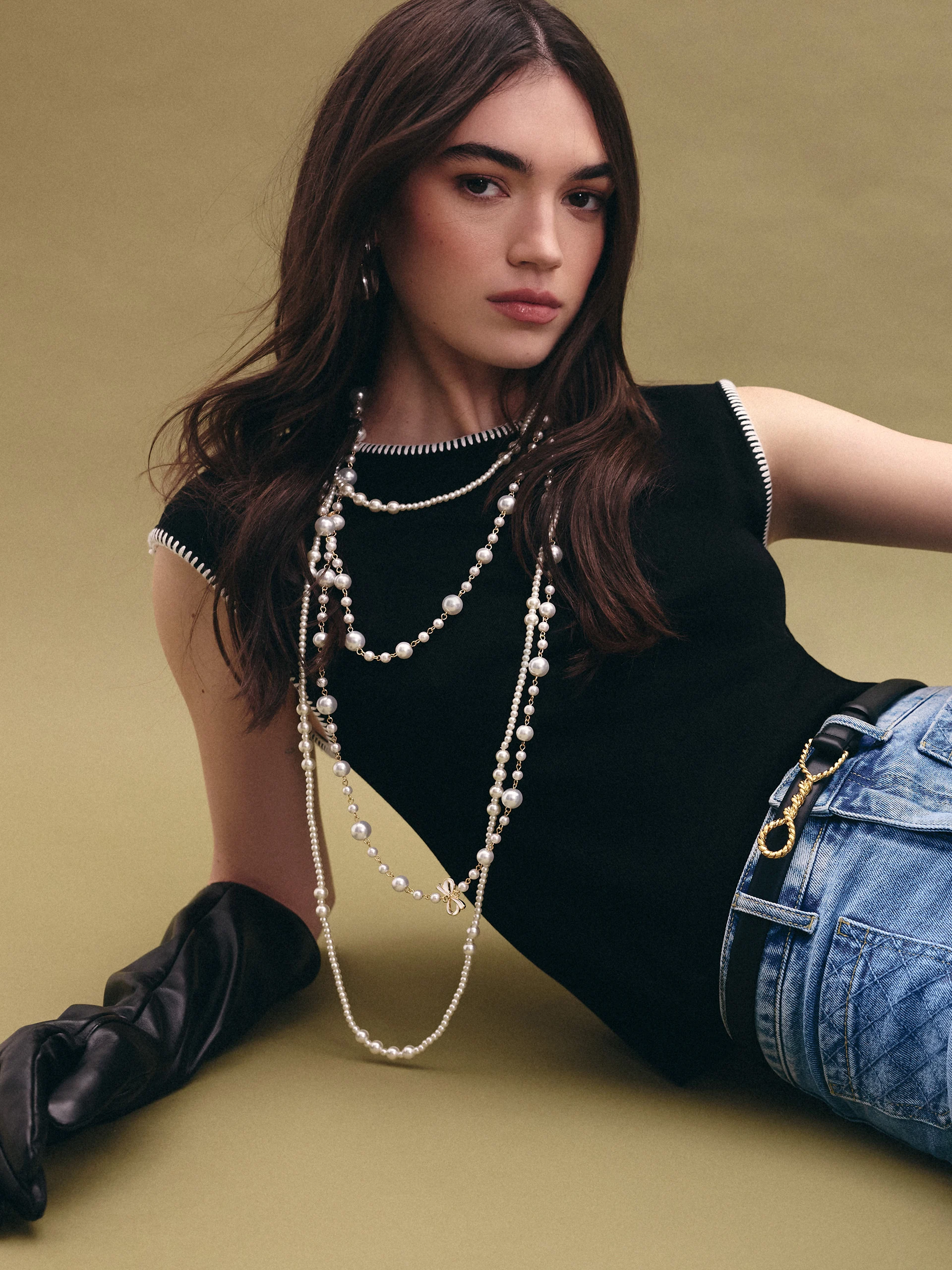Black sleeveless top with decorative trim