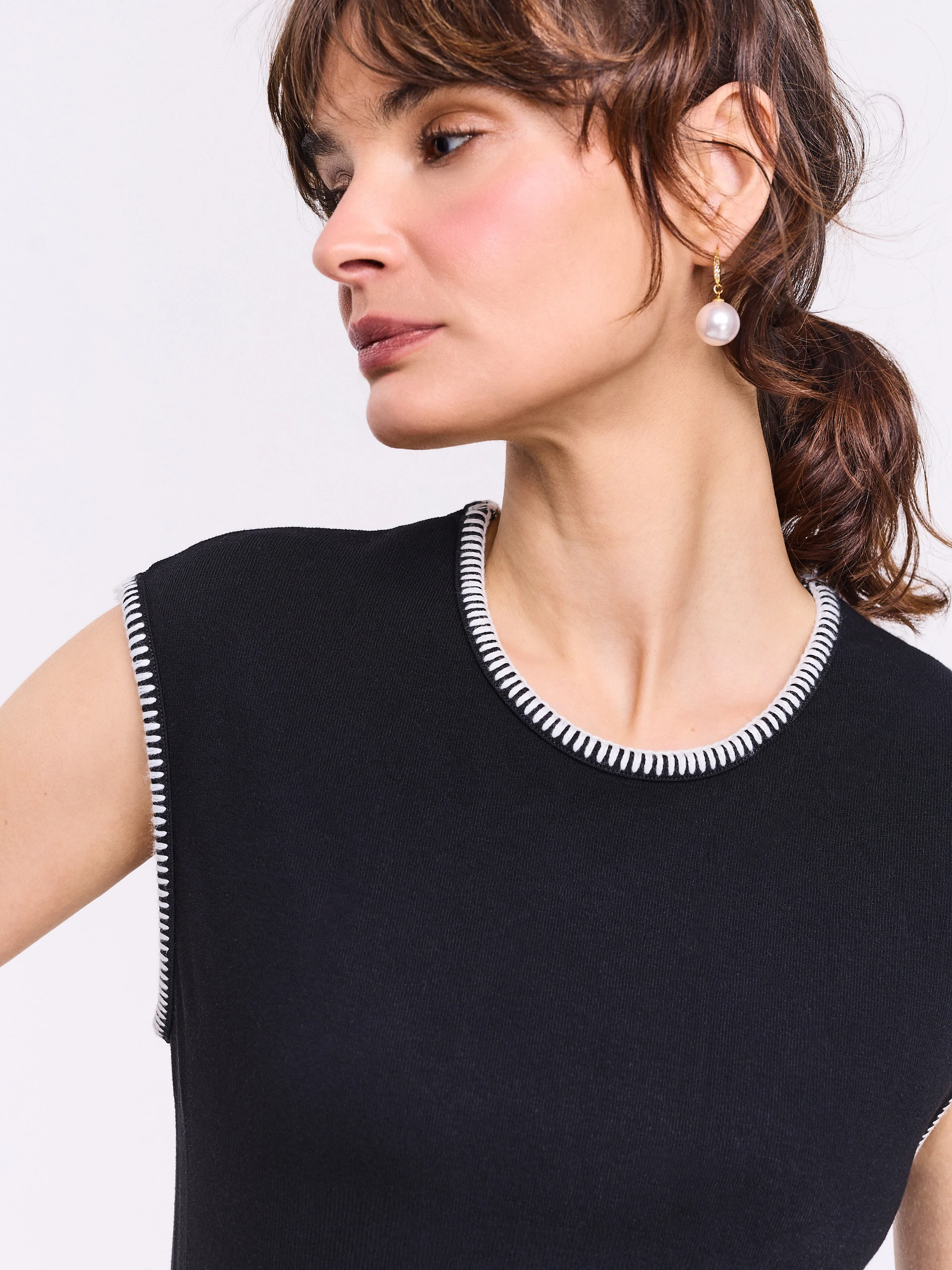 Black sleeveless top with decorative trim