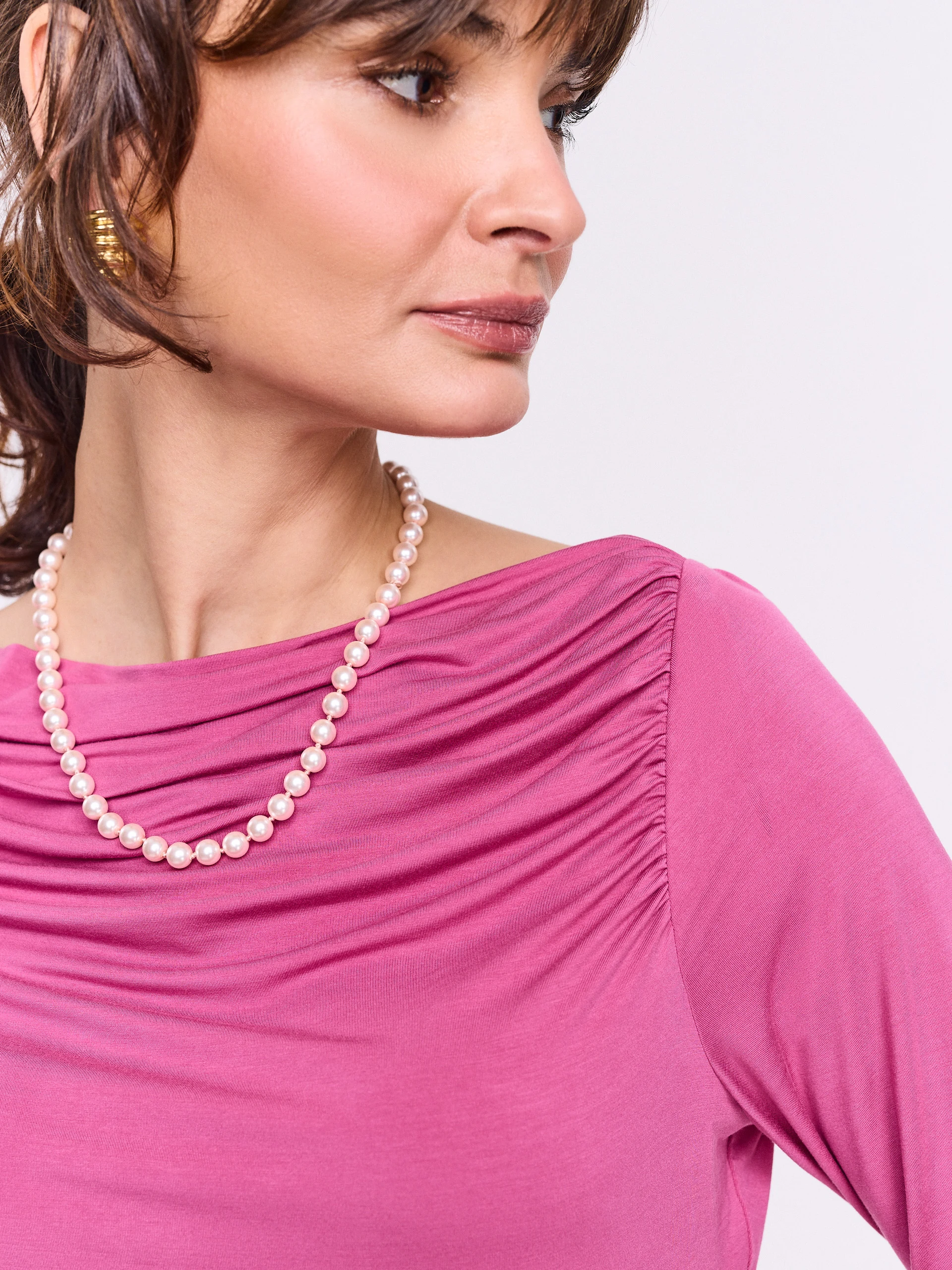 Pink blouse with ruffles and long sleeves