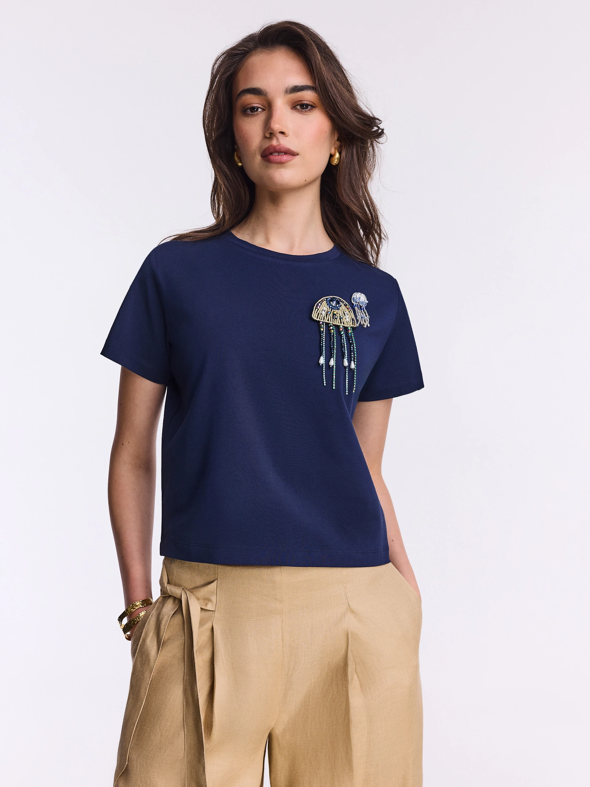 Navy blue cotton blouse with beaded brooches
