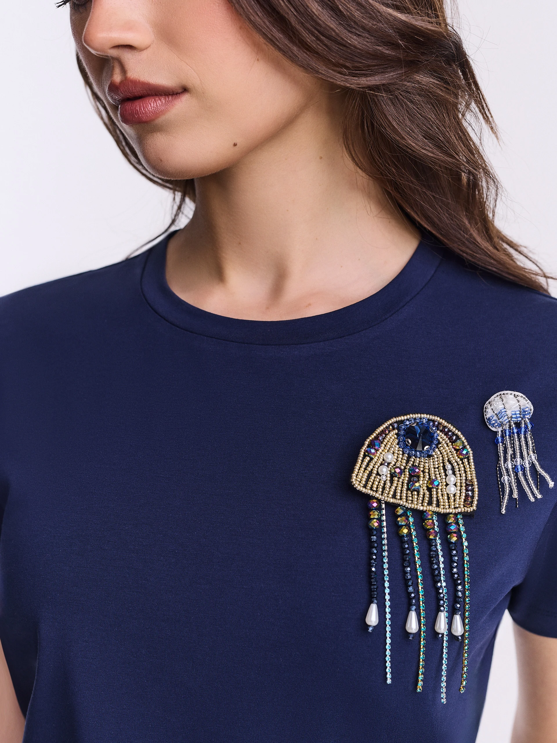 Navy blue cotton blouse with beaded brooches