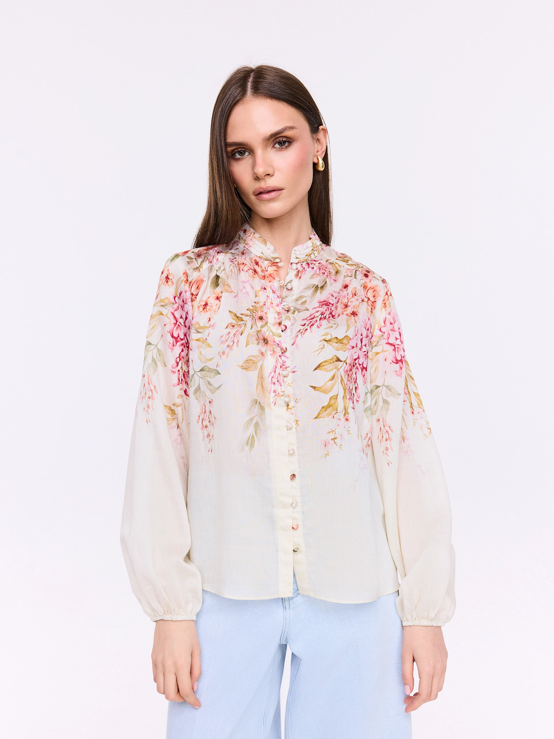 Creamy shirt with a stand-up collar and floral patterns