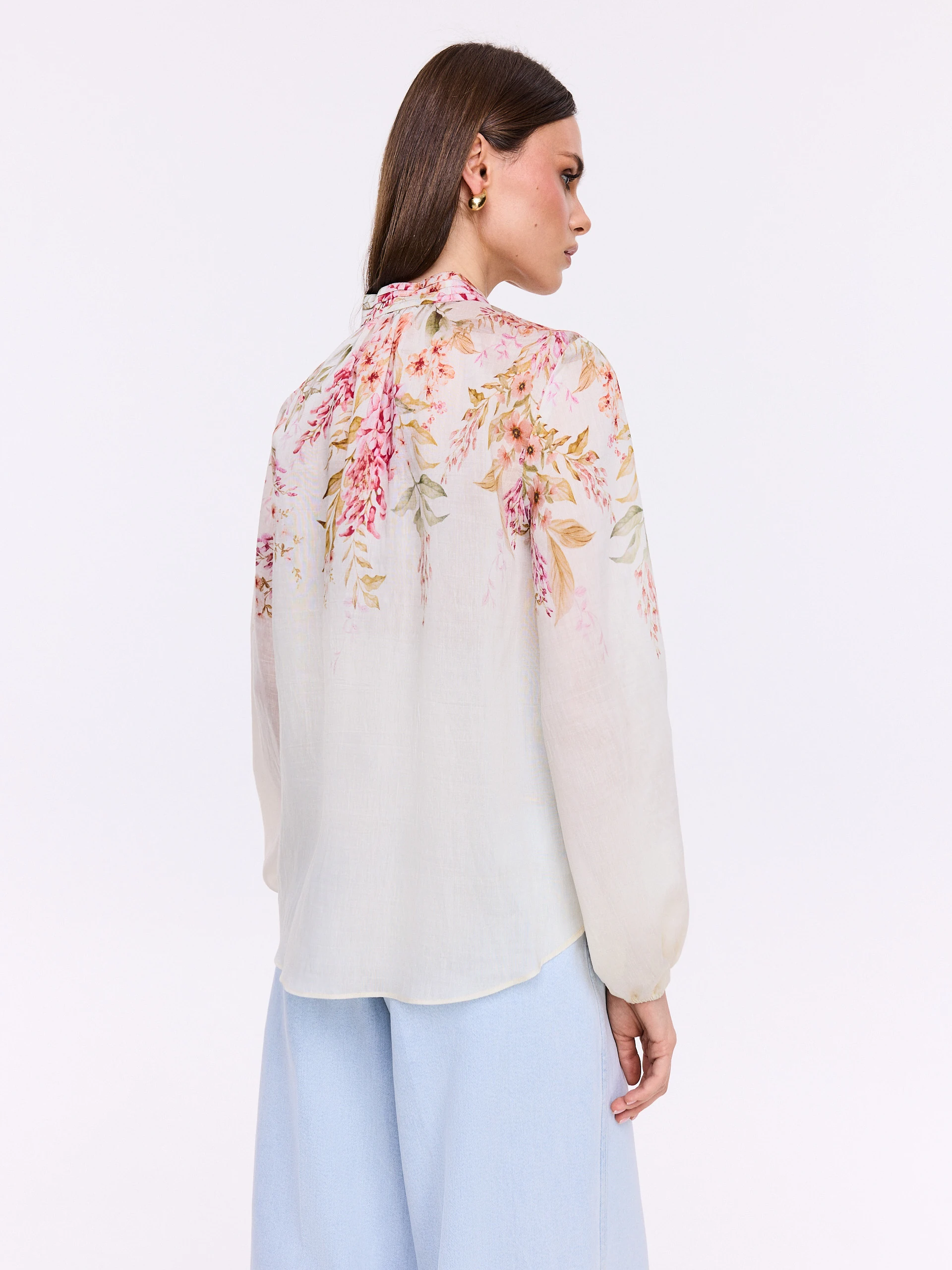 Creamy shirt with a stand-up collar and floral patterns