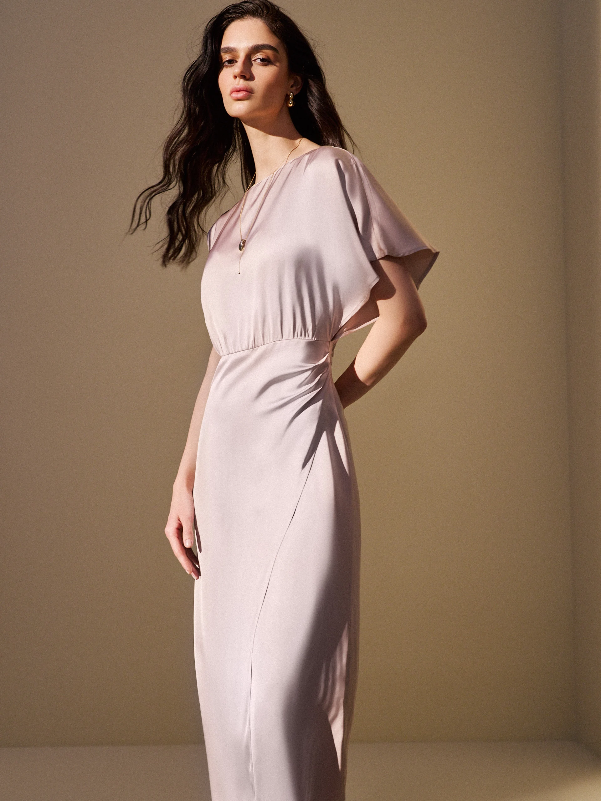 A glamorous dress with an asymmetrical sleeve