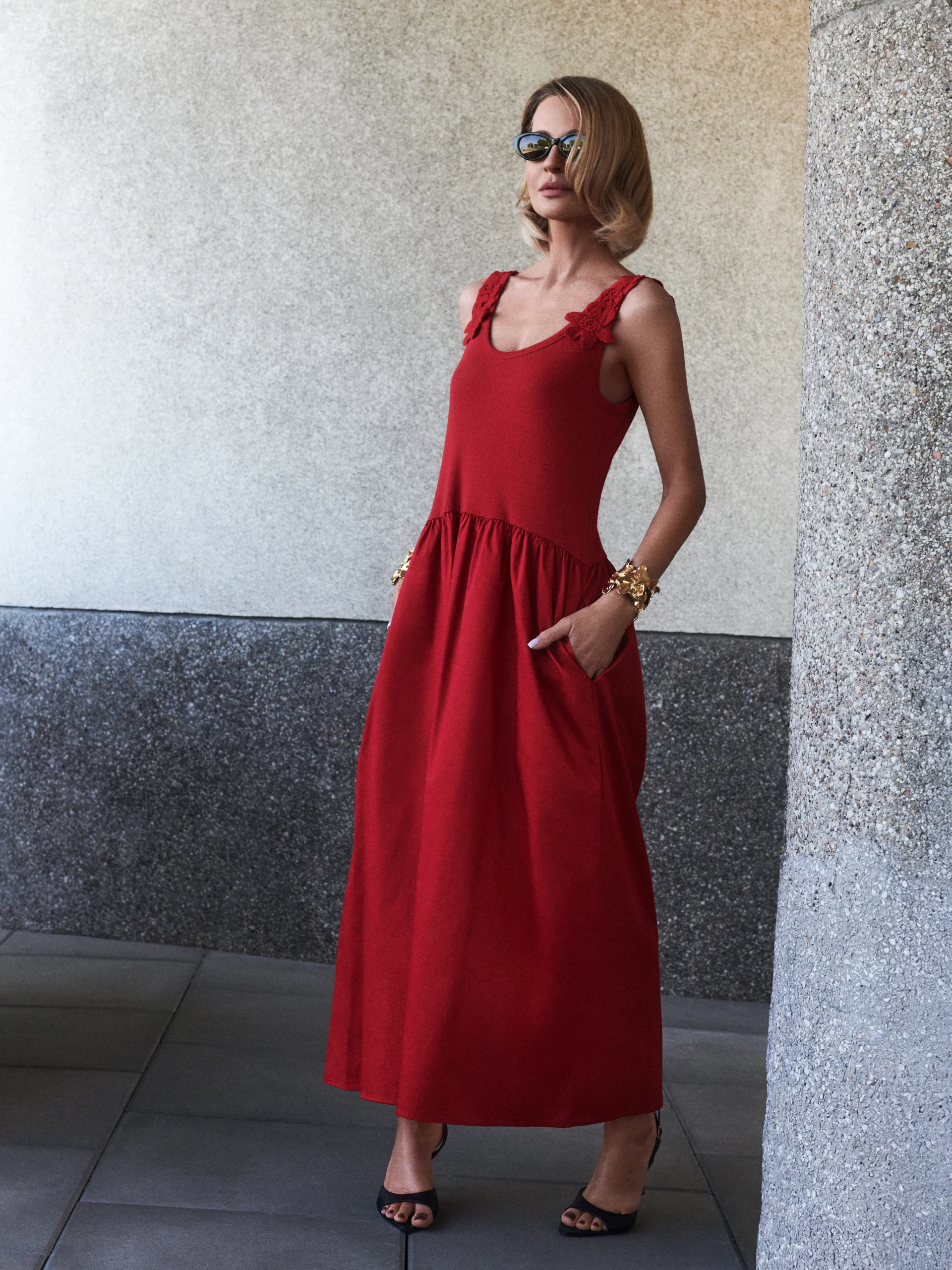 Red midi dress with decorative straps
