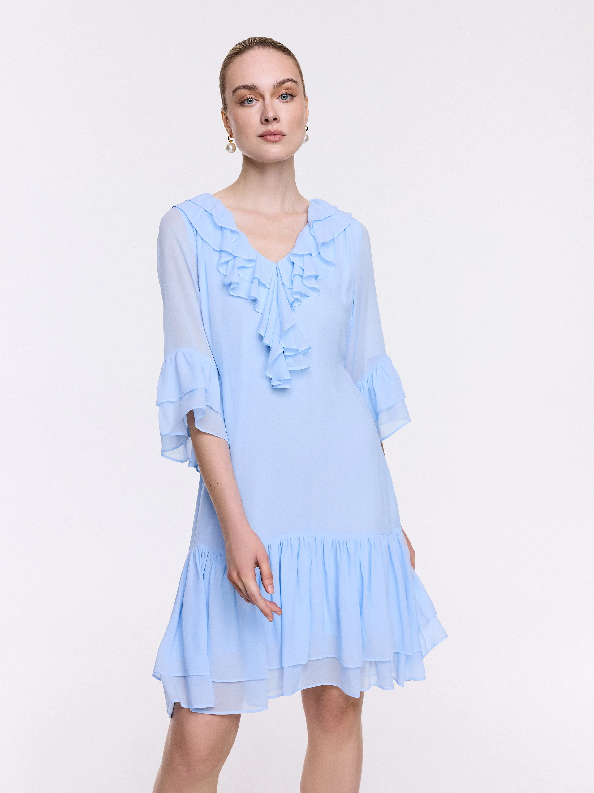 A short blue dress with ruffles